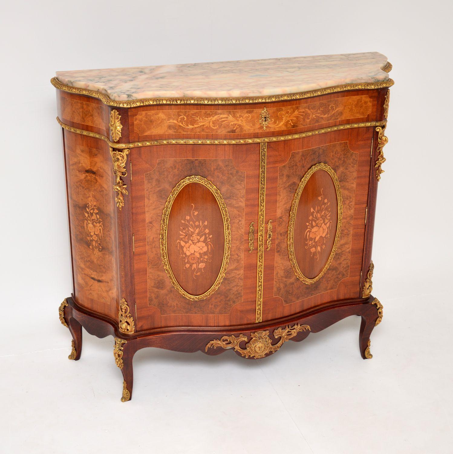 An absolutely gorgeous and extremely impressive antique French style cabinet. This was made in France, it dates from around the 1930-50’s.

It is made from a combination of burr walnut and other woods, with beautiful floral marquetry in satin wood.