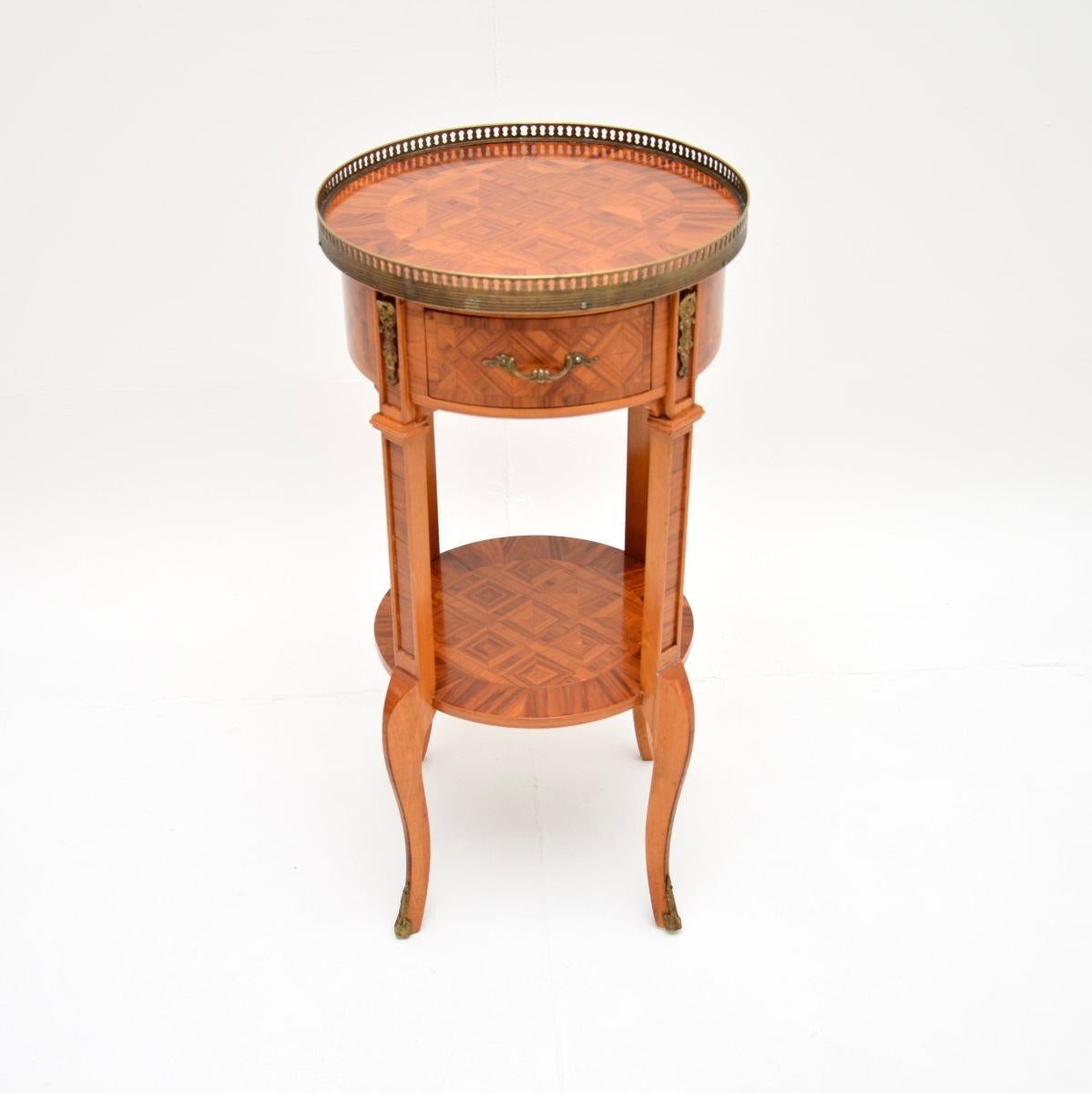 An absolutely stunning antique French inlaid walnut side table, dating from around the 1930’s.

This is of superb quality, it is beautifully designed and is a very useful size. It is made with a solid walnut construction and gorgeous walnut veneers,
