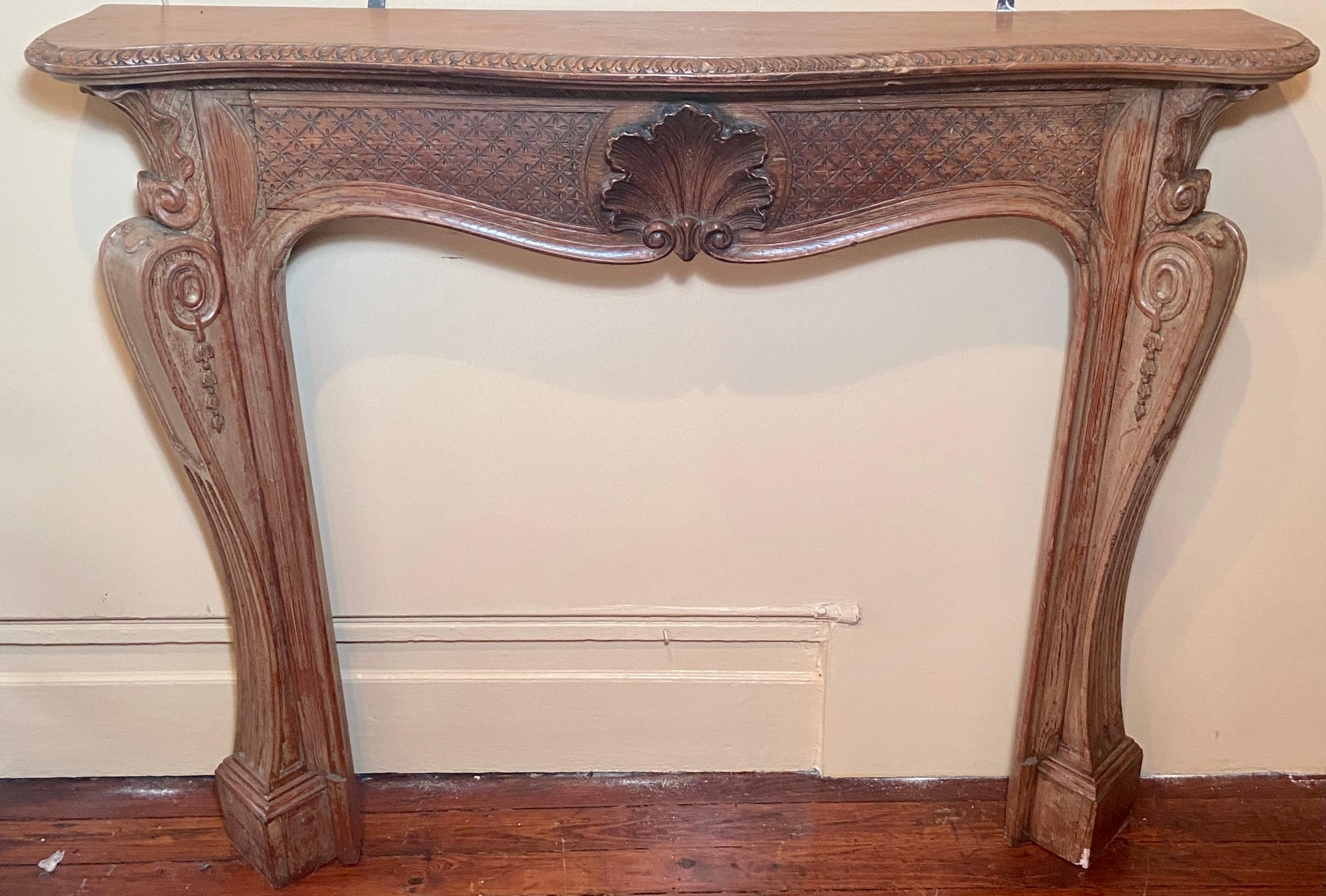 Antique French carved pine mantlepiece, Circa 1920-1930. Beautifully detailed carving.