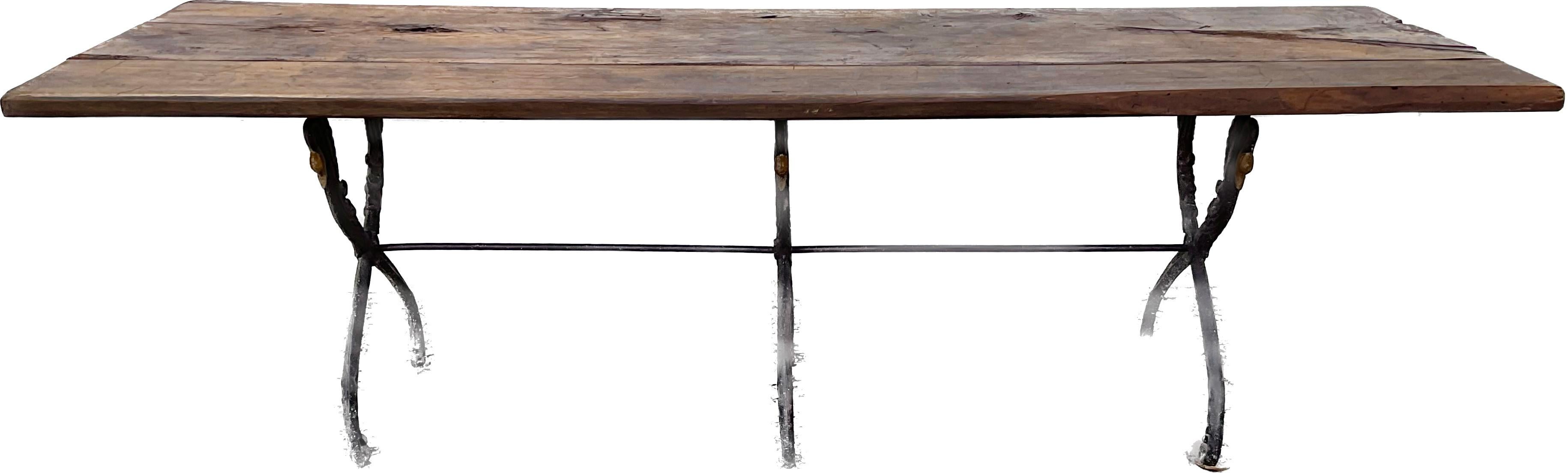 An elegant base depicting carved swans in old gilt paint and an extra-long well-proportioned top, make this versatile table wonderful for dining, as a sofa table, center table or as a desk with lots of room. The thick walnut wooden top appears older