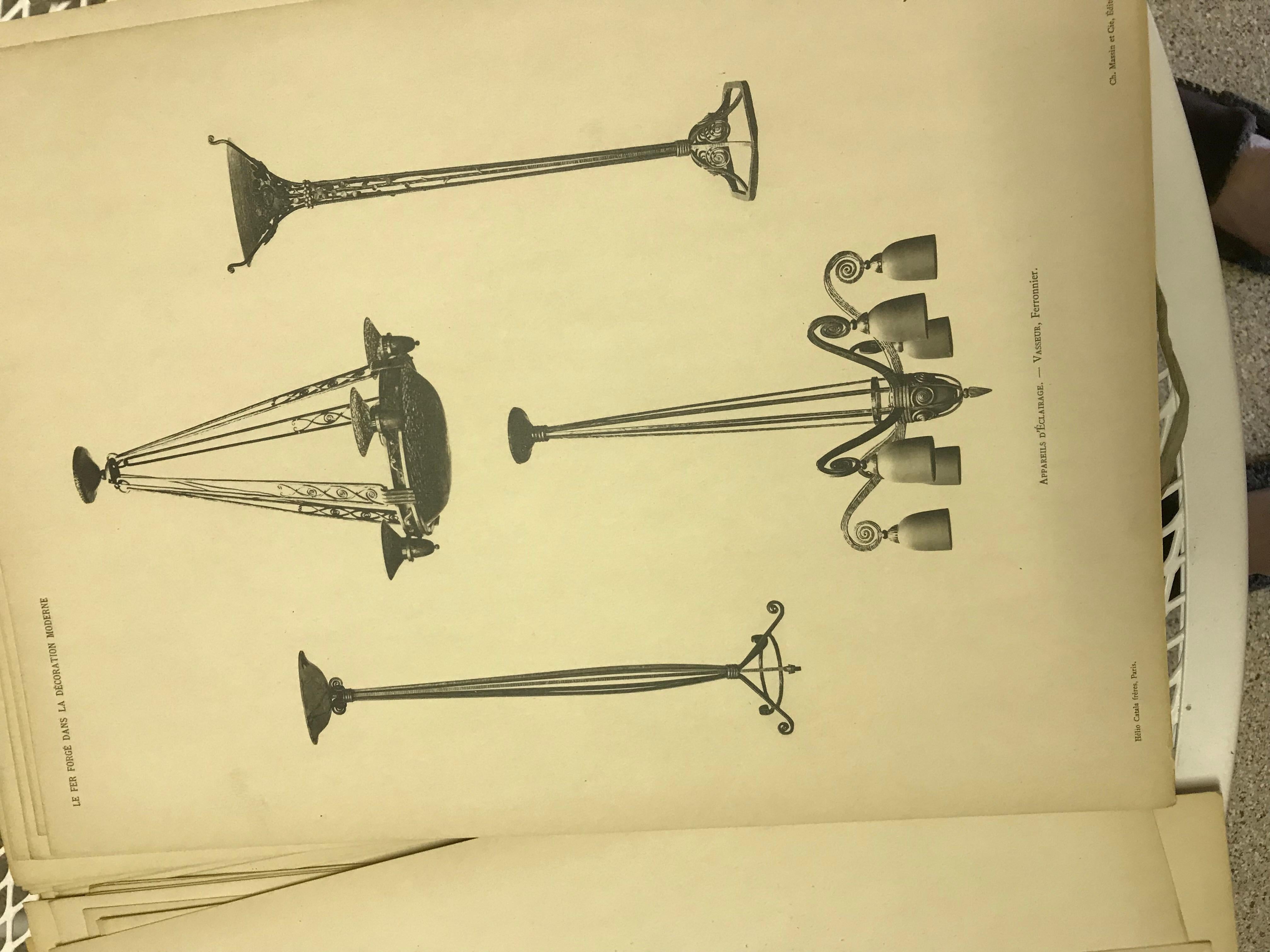 Large Hard back Book of Famous Iron Artist in Paris, France. Dated 1925 and 36 loose illustrations of interior designs and exterior designs for buildings and interior Lighting Very Rare book to find now. More of an antique find. Items you have never