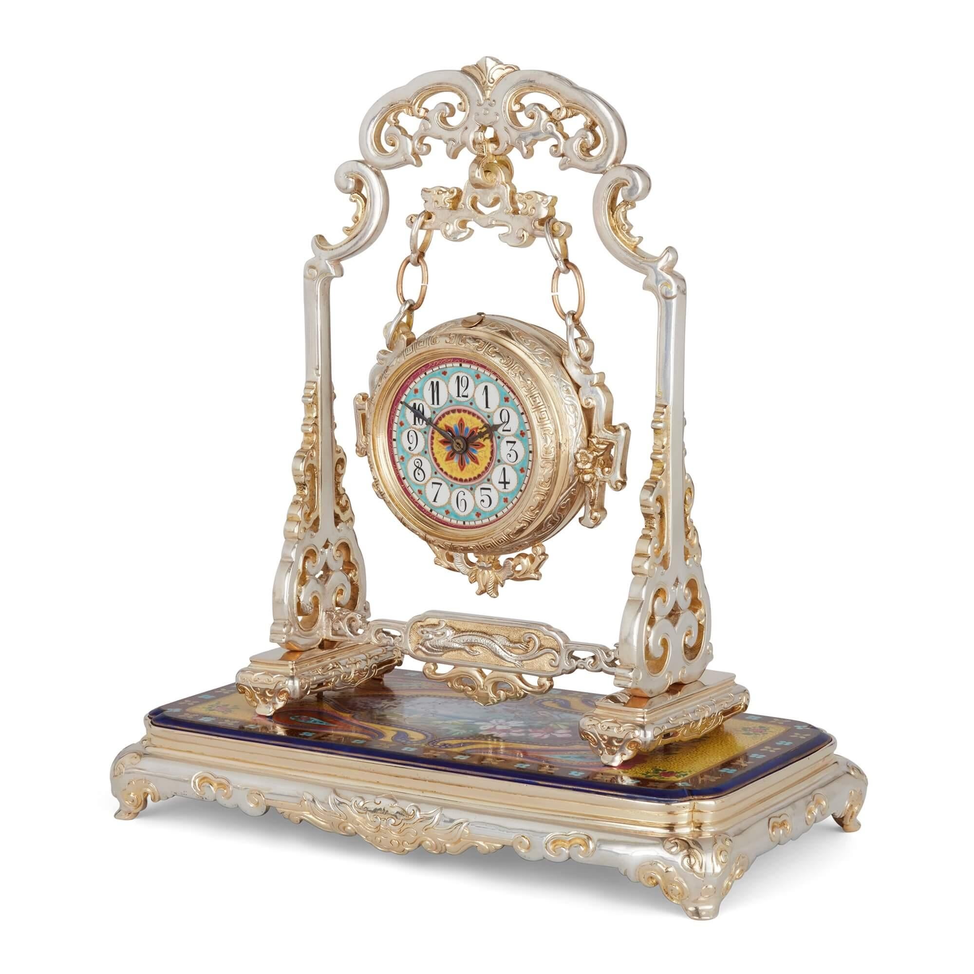 Antique French Japonisme silvered bronze and porcelain three-piece clock set 
French, Late 19th Century 
Clock: Height 36cm, width 32cm, depth 17cm 
Candelabra: Height 28cm, width 26cm, depth 10cm

This Japonisme three-piece clock garniture