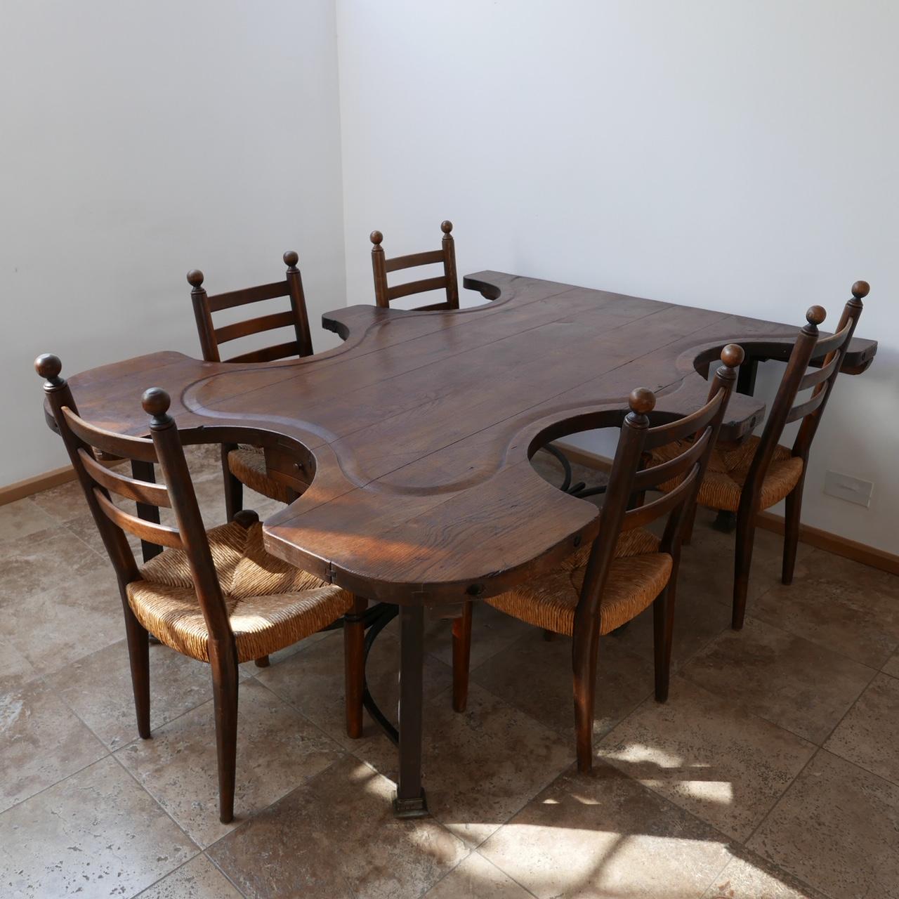 A rare immense quality antique table originally used for jewelry making.

Now the most amazing and unusual dining or work table.

On the original metal base, the old gas taps used for heating equipment remains under the base providing a great