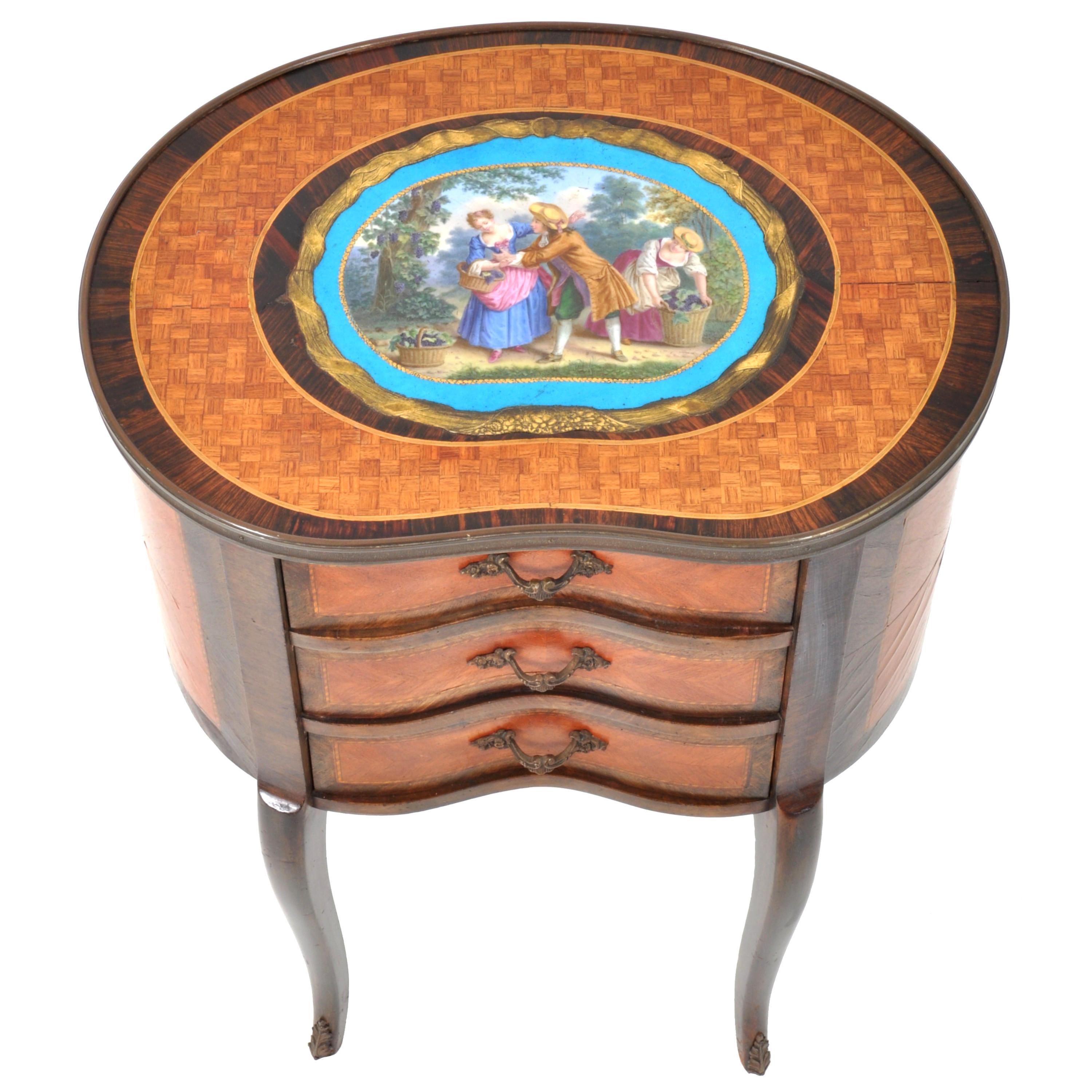 A very fine antique French Louis XV style inlaid 'kidney' shaped side table or chest, inlaid walnut with a large Sevres style plaque depicting lovers in 18th century dress, circa 1880. The top is inlaid with a large enameled 'Bleu Celeste' Sevres