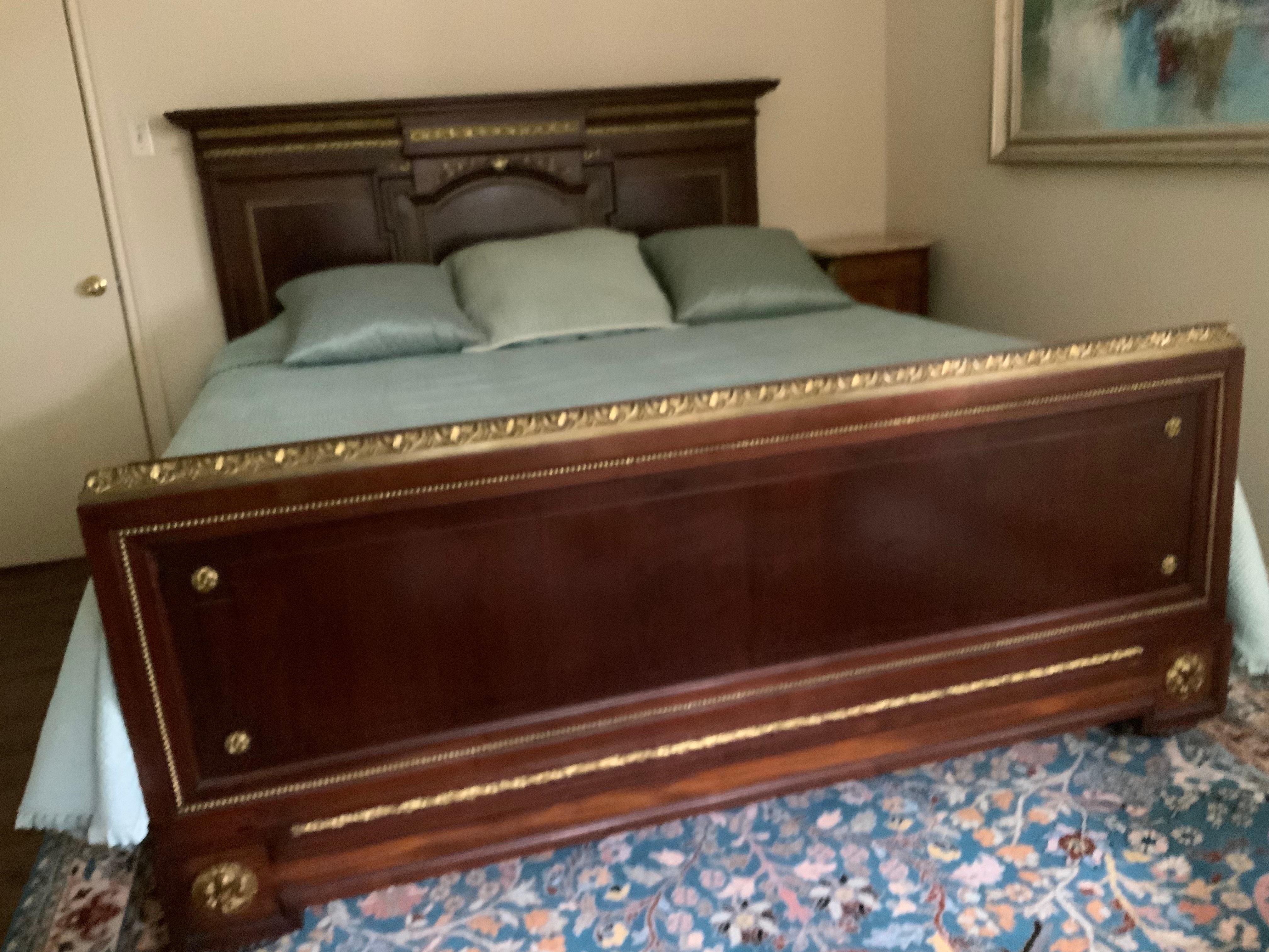 Large headboard and footboard are supported by 4” thick side rails.
The mahogany is fine and in great condition. The size is a bit smaller
Than king in the width but the side rails support a king as pictured 
In the photograph. It has fine detail
