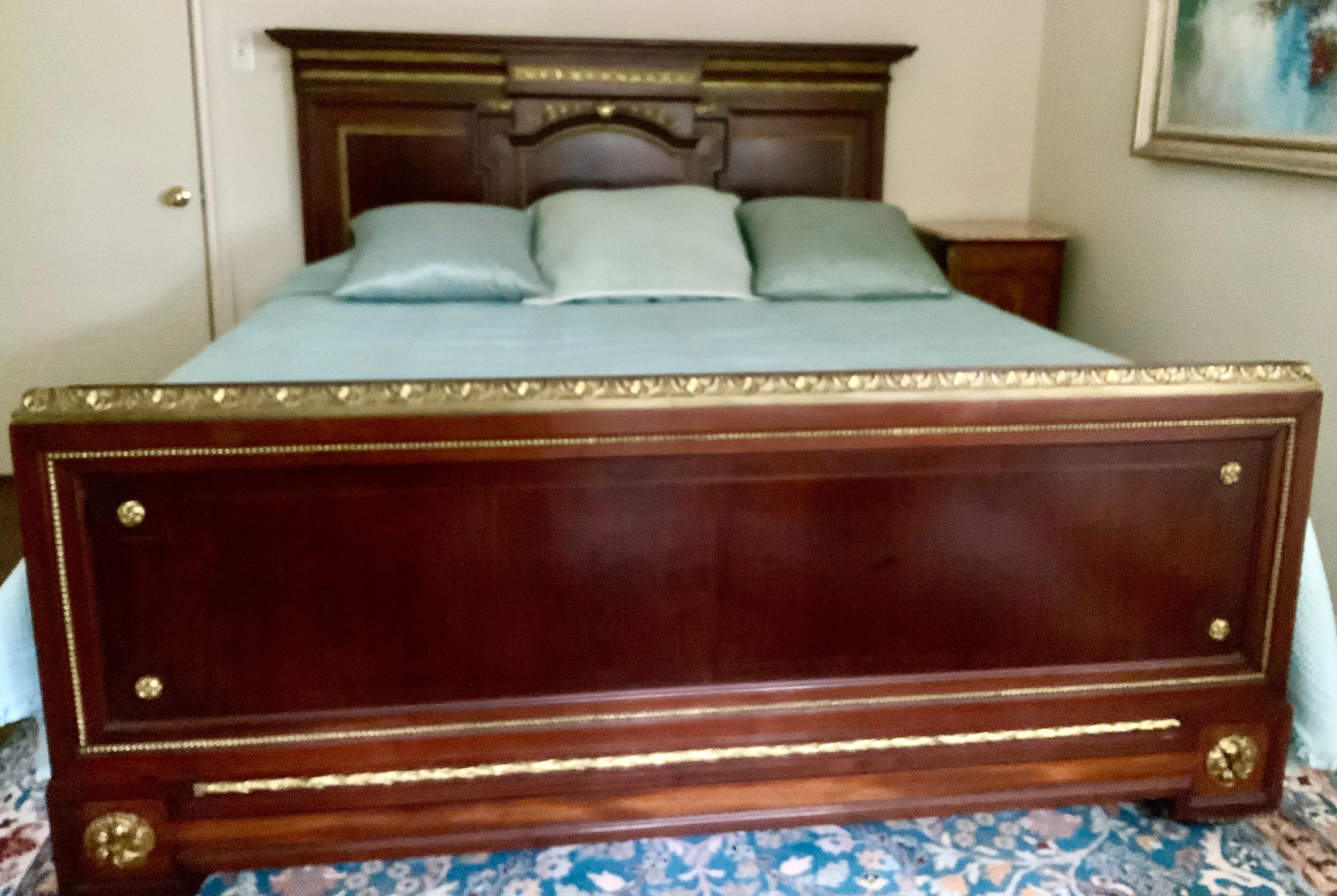 Mahogany Antique French Kingsize bed, mahogany with gilt bronze accent For Sale