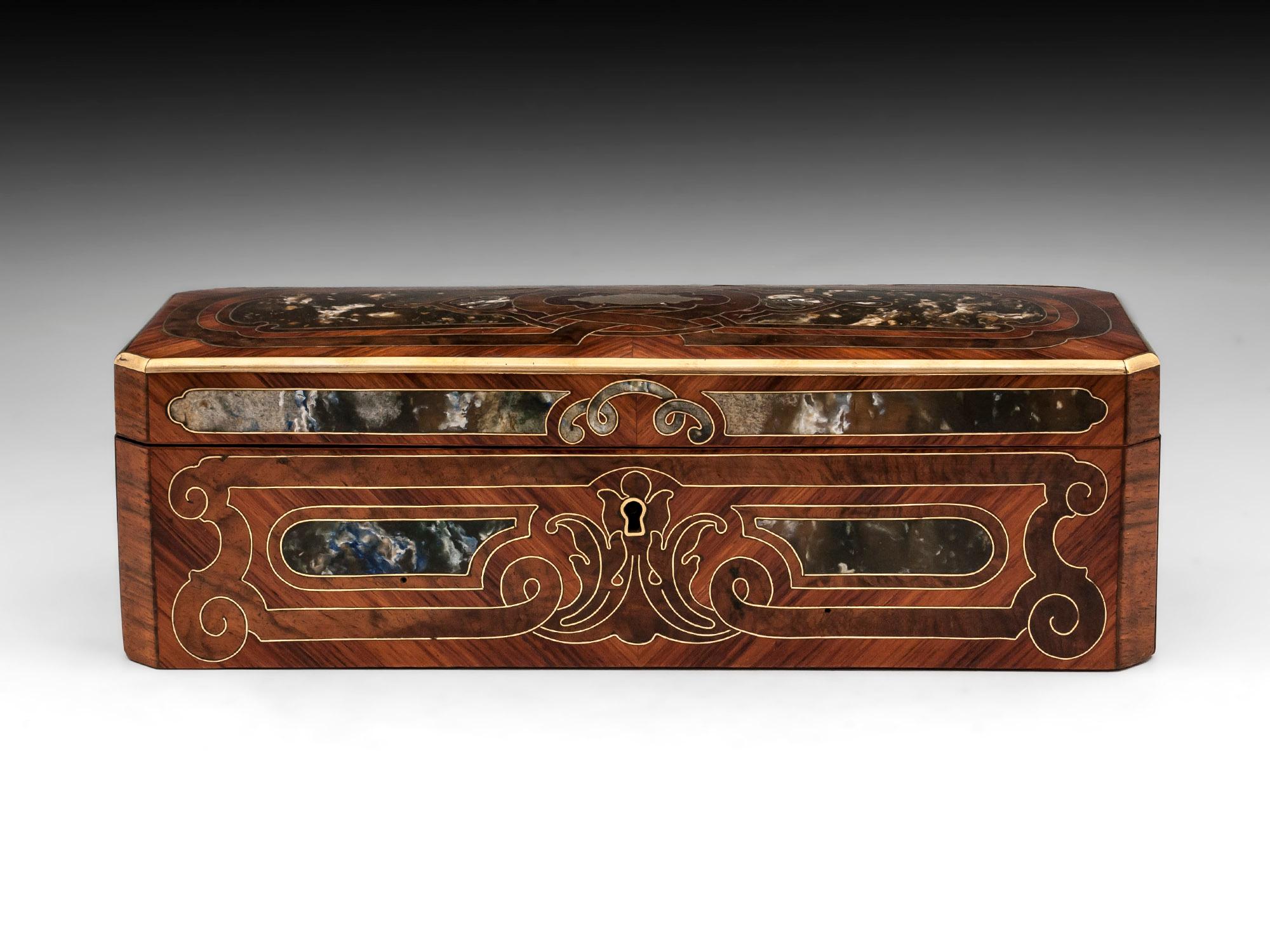 Antique French glove box veneered in beautiful Kingwood, with beautiful very unusual elaborate green / blue marbling panels framed with fine brass stringing. 

The interior of this fabulous glove box has been re-lined with green silk paper and