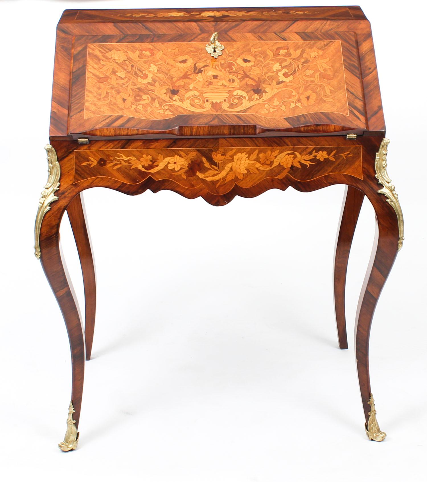 This is an elegant antique French Louis Revival ormolu-mounted bureau de dame with a beautiful fitted interior, dating from circa 1860.

This magnificent piece is of the finest kingwood and walnut, it features profuse marquetry decoration and