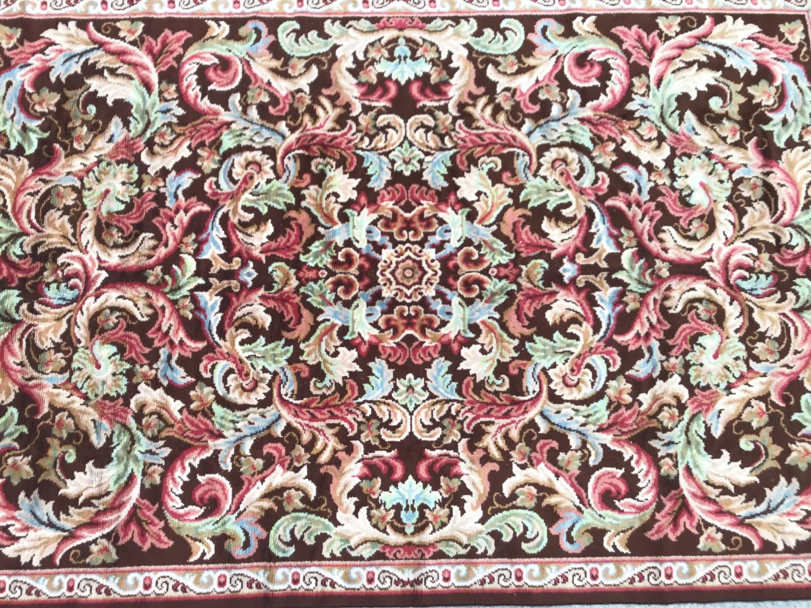 Beautiful French Aubusson rug with a Savonnerie floral design and nice colors with brown, pink, blue and green, entirely knotted with wool velvet on cotton foundations.