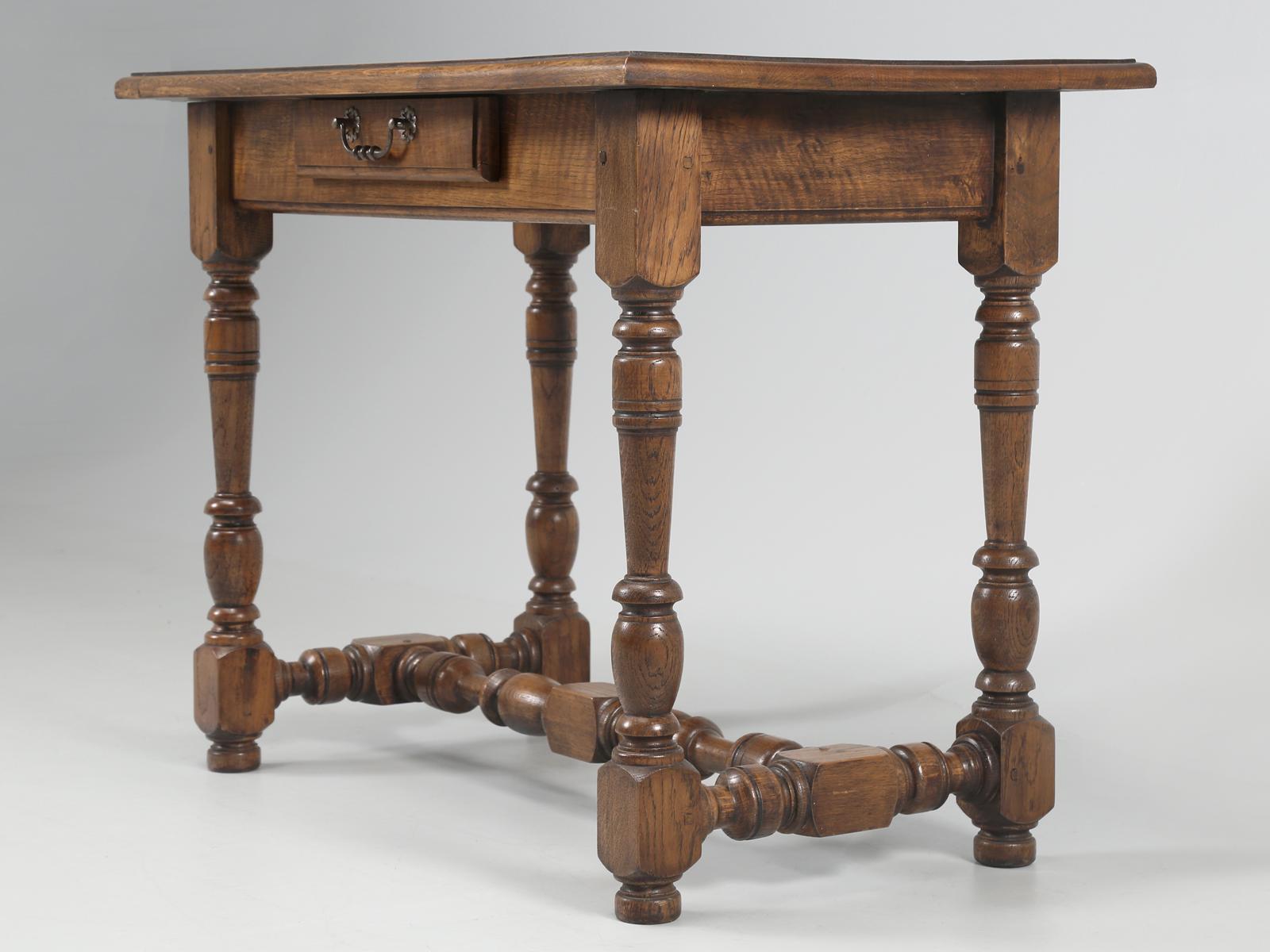 Antique French oak ladies writing table or desk. Also, works as an end table or side table. Our in house restoration department restored the finish back to its original French walnut color, although the antique table is constructed from white oak.