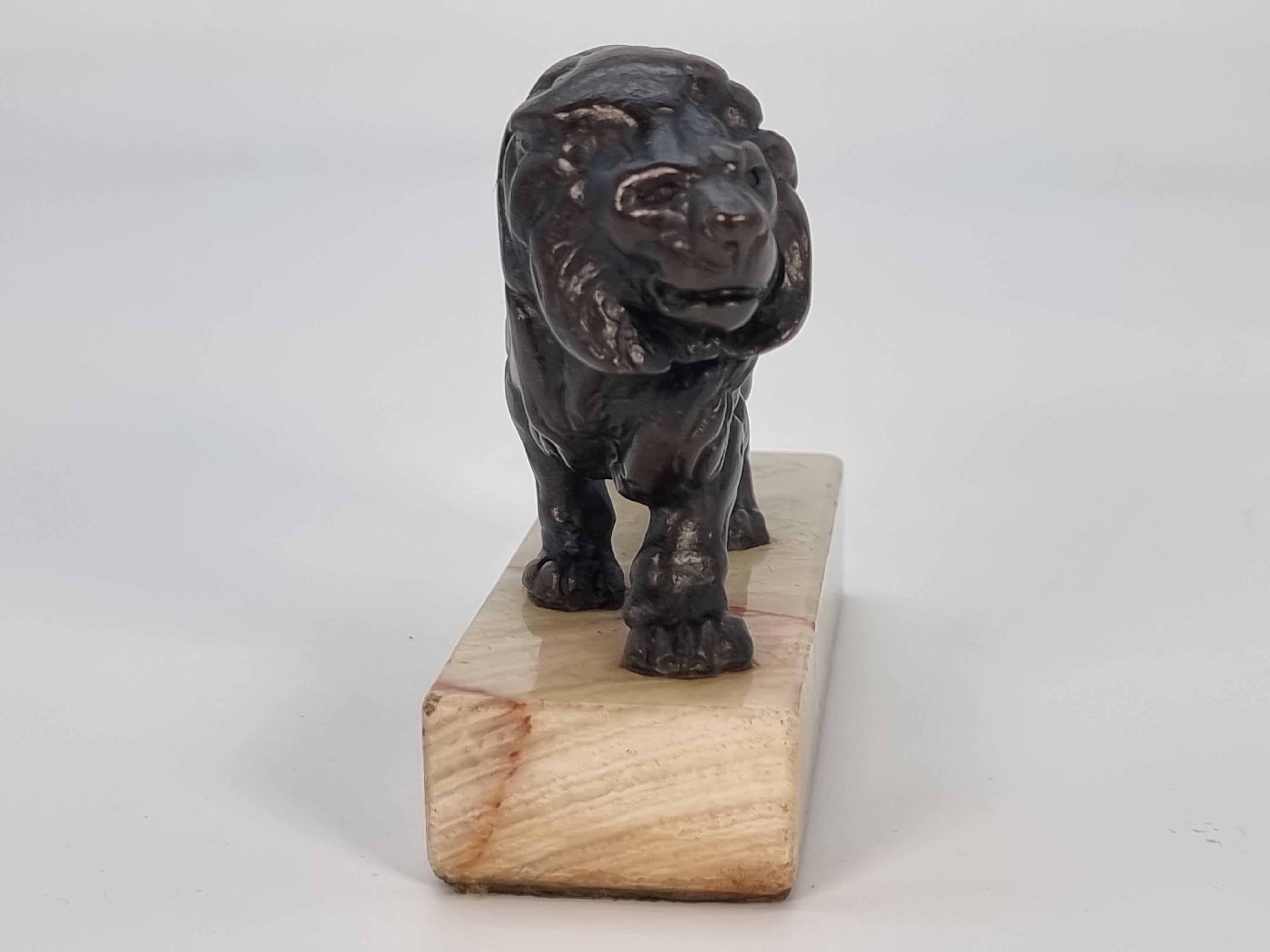 Louis Philippe Antique French late 19th century bronze study of a prowling lion circa 1900 For Sale
