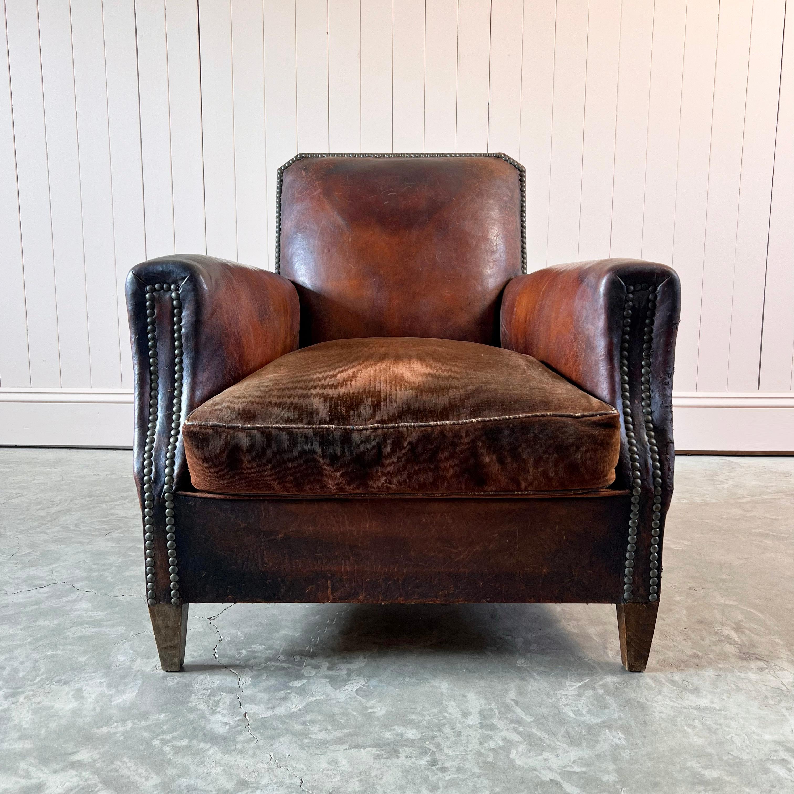 Circa 1900 this is a cracker of a French leather armchair.

Earlier than the more available club chairs, with just the most fantastic natural colour and patina to the leather.

This chair is 100% authentic, including the cushion and the springs,