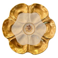 Antiker französischer Austernteller „Lewis Strauss“ aus Limoges-Porzellan in Gold und Elfenbein, 1900