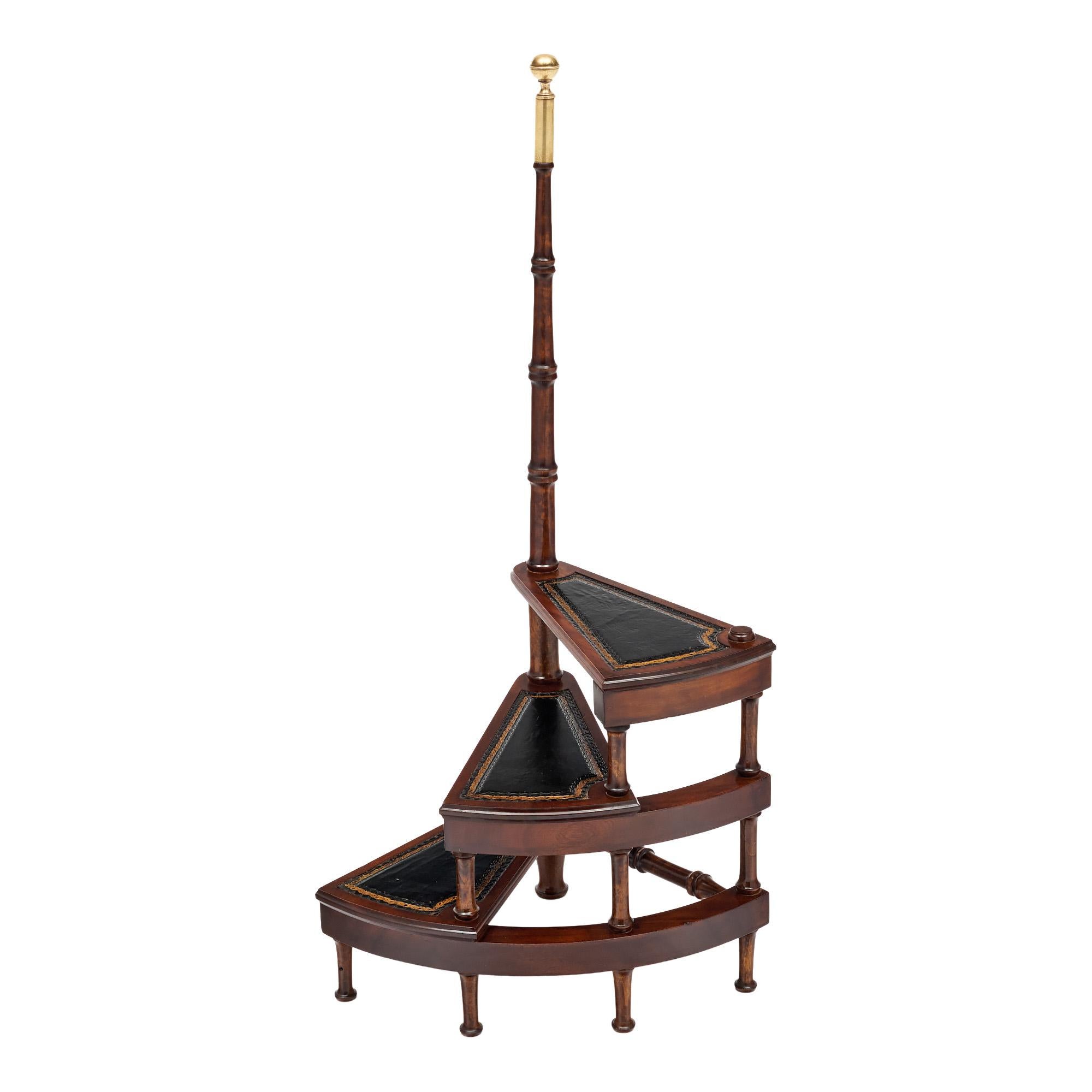 Library stairs from France made of solid wood construction, primarily walnut and finished with a lustrous French polish of museum quality. We loved the solid brass finial on top of the pole. There are three steps lined with gilt embossed black