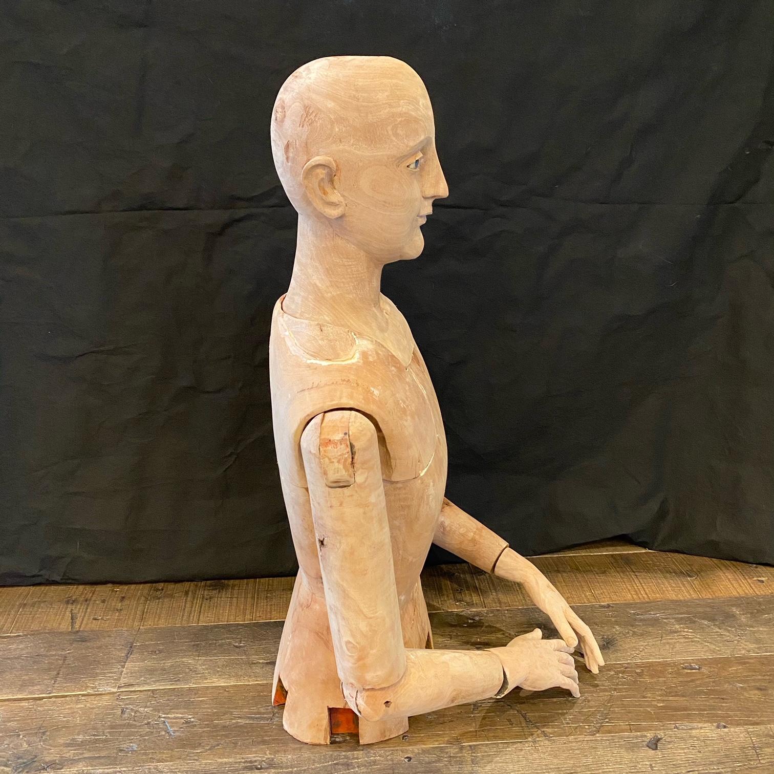 Antique French sculpted and carved wood mannequin was recently restored and is striking in its life size scale and piercing blue painted eyes. Arms and head remove for shipping. #5376:
Bust: H 14.5” x W 8” x D 8.5”.