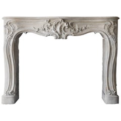 Antique French Limestone Fireplace of the 18th Century, Style of Louis XV