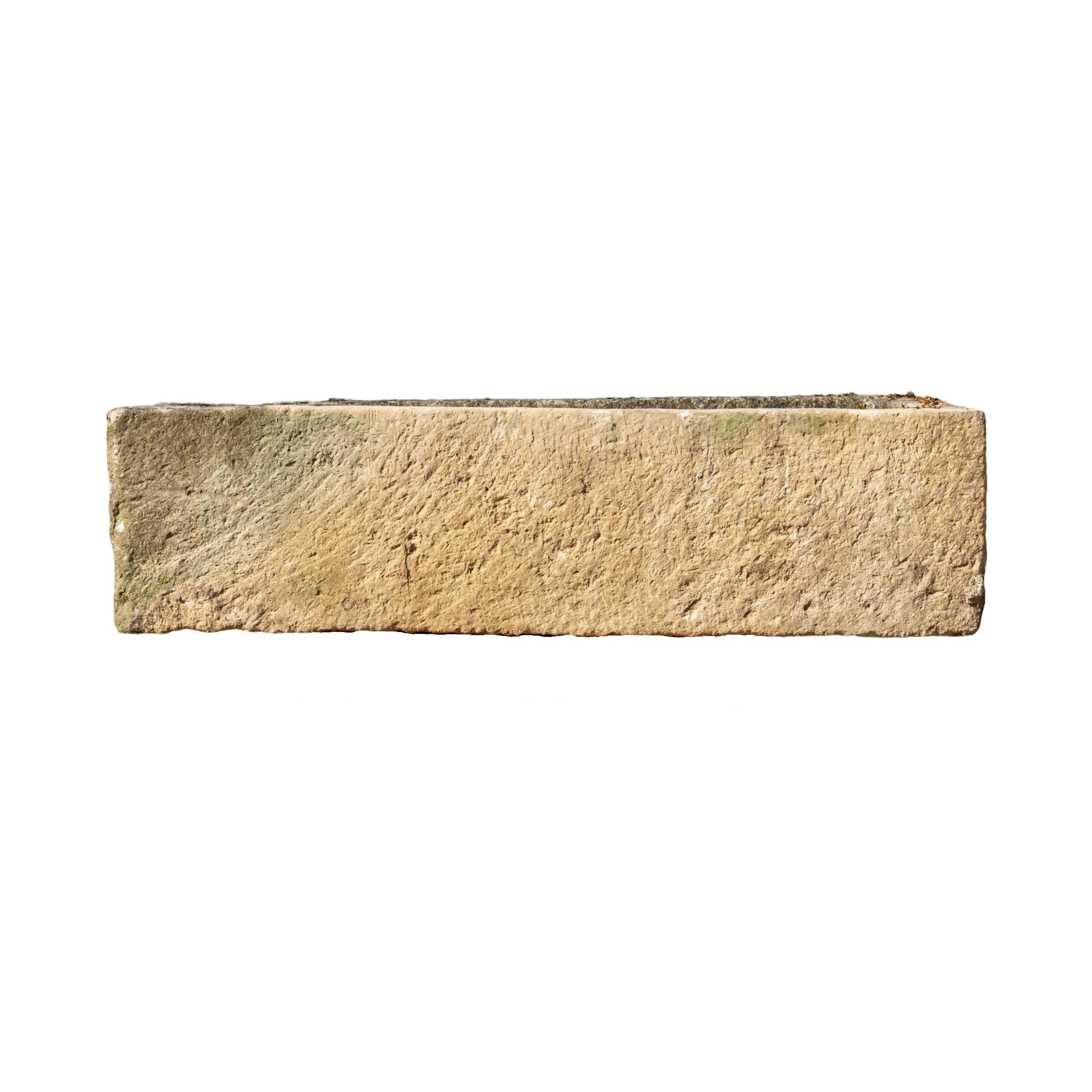Enhance your garden or patio with this authentic 18th century French limestone trough. Use it as a statement piece for bedding florals or turn it into a beautiful fountain. Its antique charm and durable construction make it perfect for any outdoor