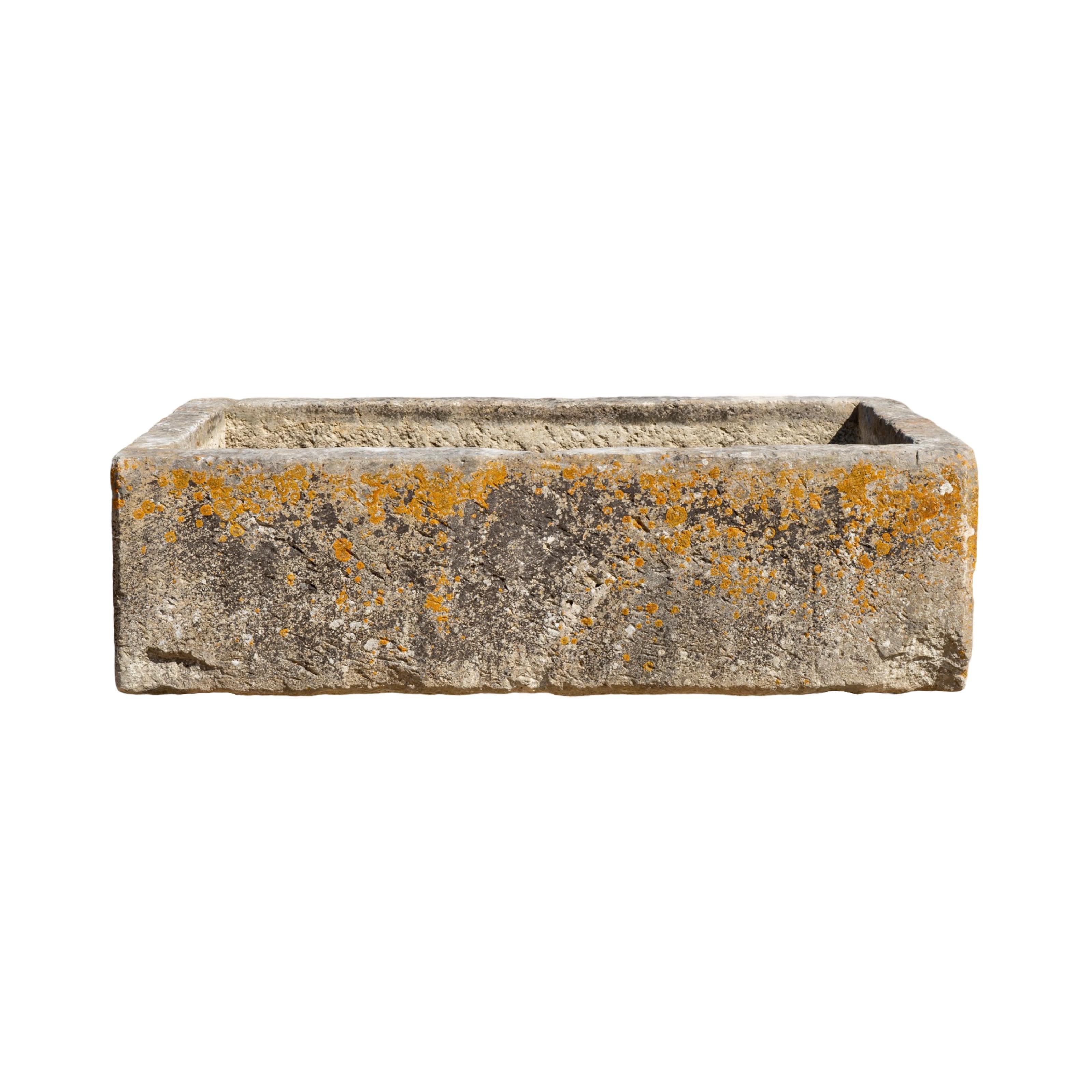 This 18th-century Antique French Limestone Trough is a unique and beautiful addition to any outdoor space. Its character patina and reclaimed European origin give it a sense of history and charm. It is perfect for adding a touch of elegance to any