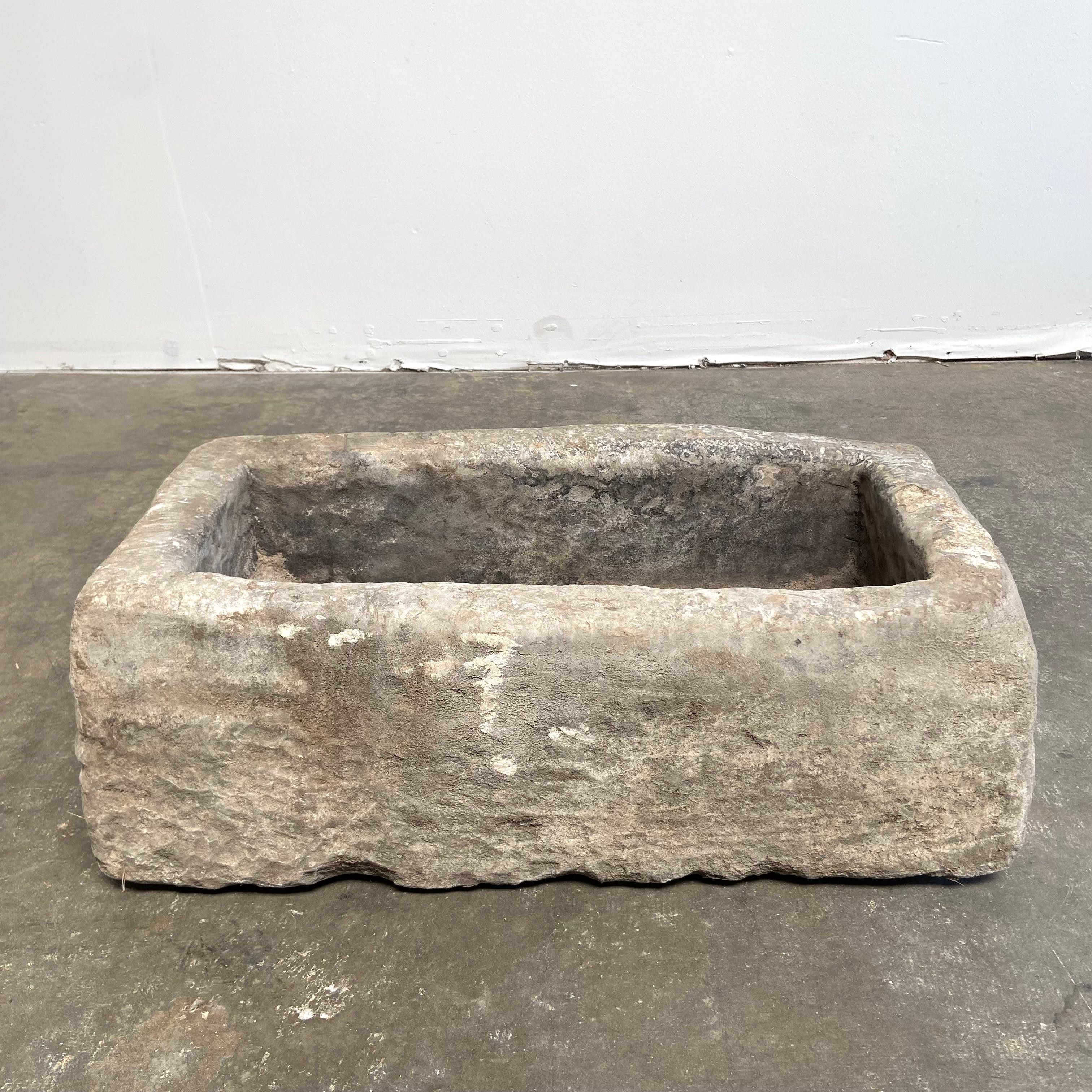 Antique European limestone trough
Great for use as a fountain, planter, or garden element.
Size: 34”w x 17”d x 12”h
tree not included.