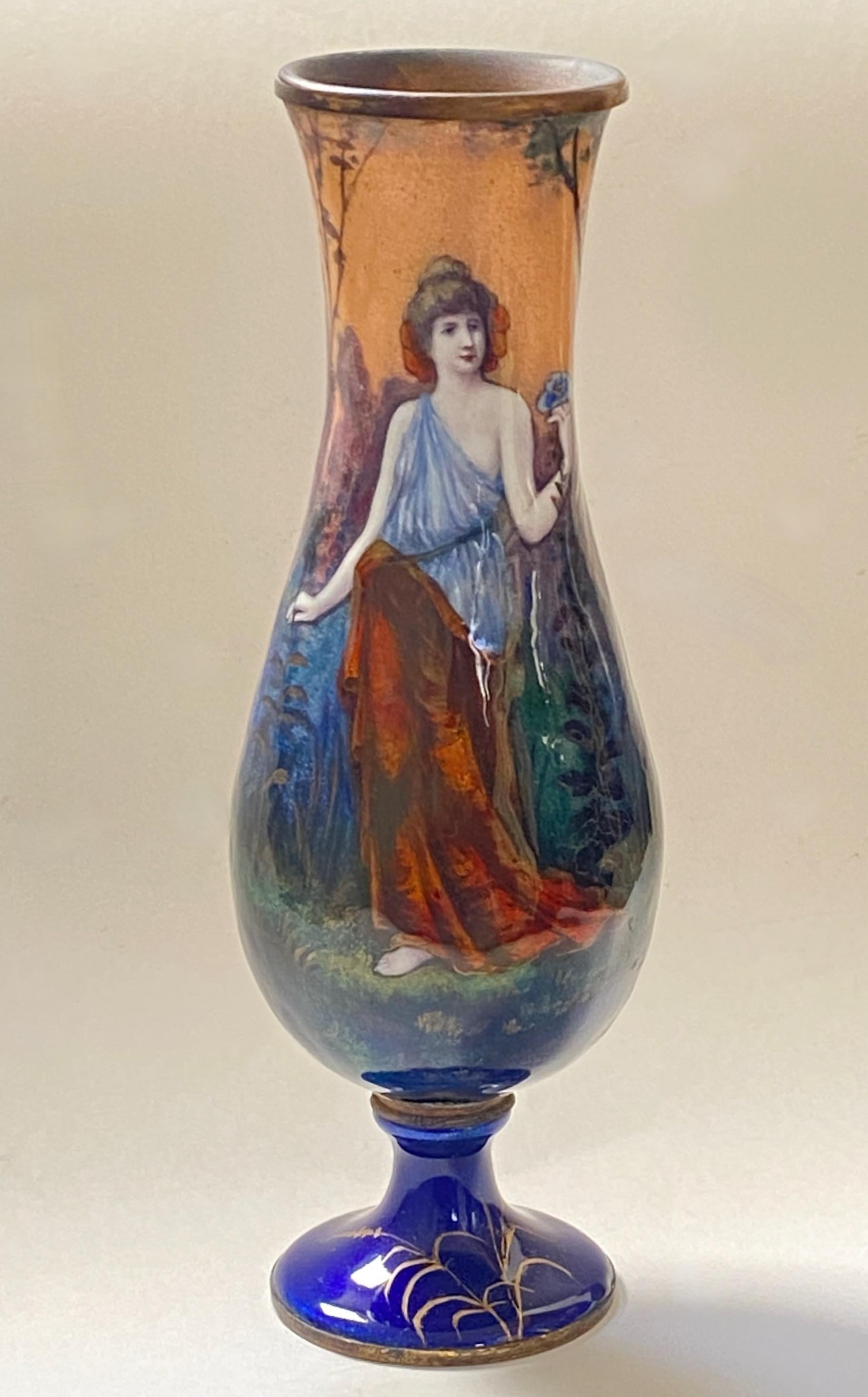 A small antique baluster shape portrait vase. Enamel on copper with a hand painted young woman and romantic scenic background. Unsigned.
French, second half 19th century. In excellent condition with no damage.
  