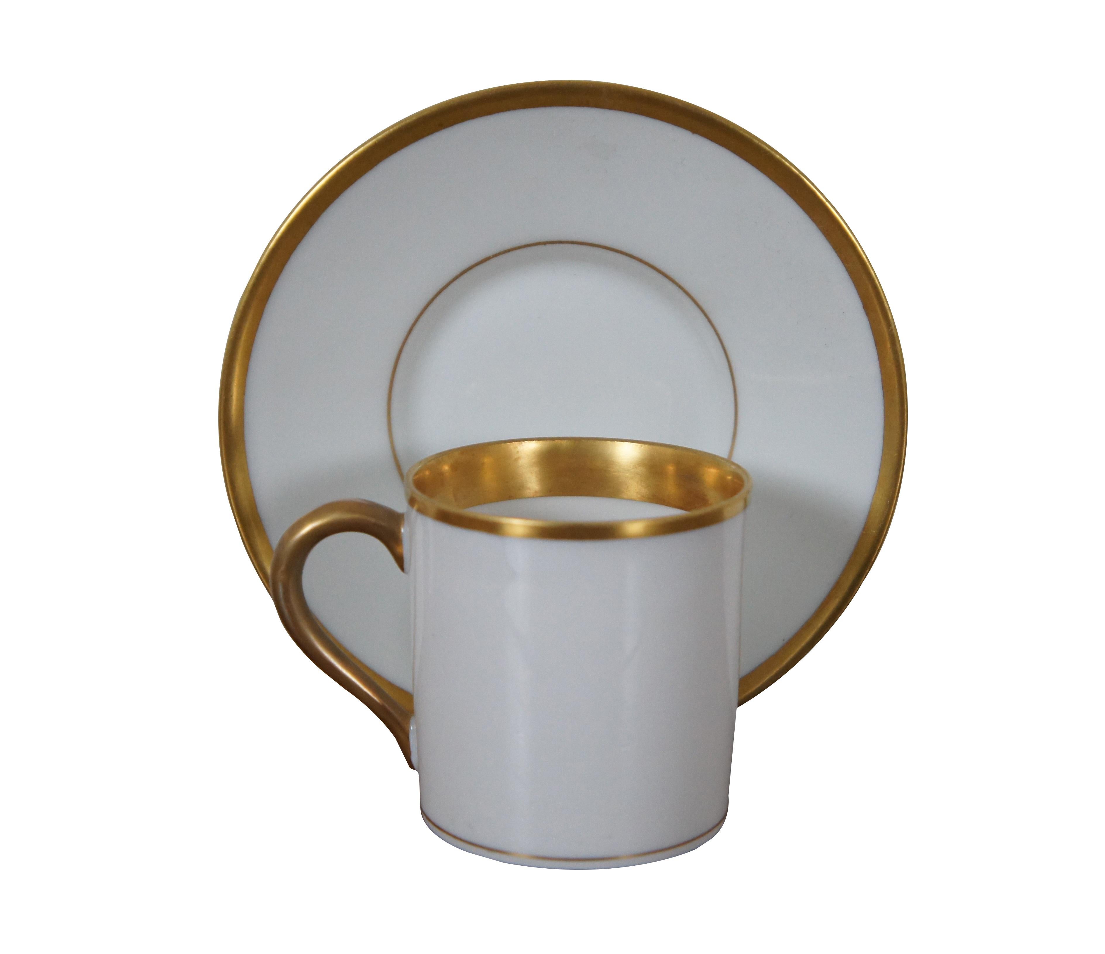 Antique French Limoges demitasse teacup and saucer featuring gold trim.  Made in France.

Dimensions:
4.75” x 2.75” (Diameter x Height)