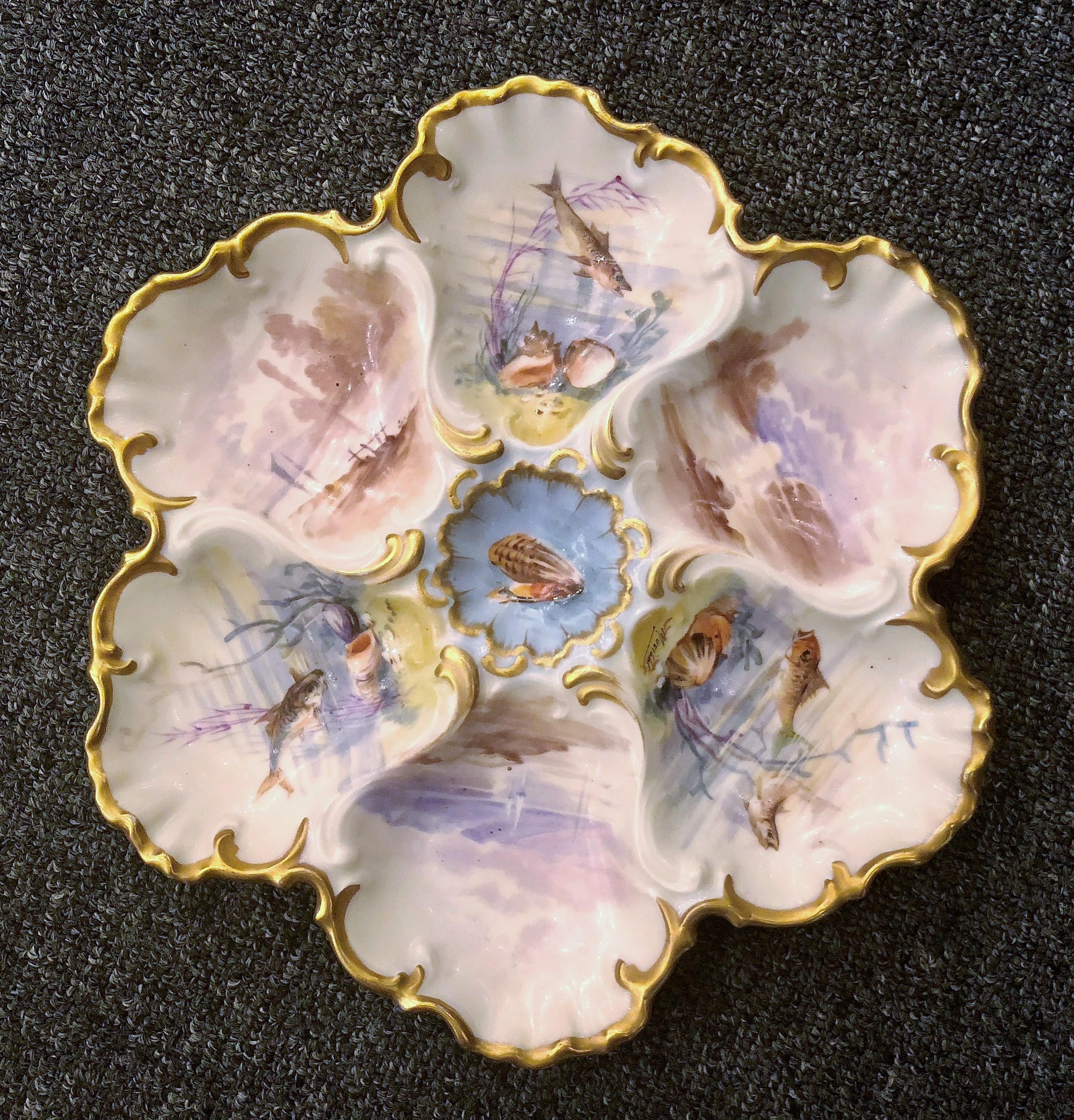 Antique French Limoges hand-painted porcelain oyster plate, circa 1890-1900.