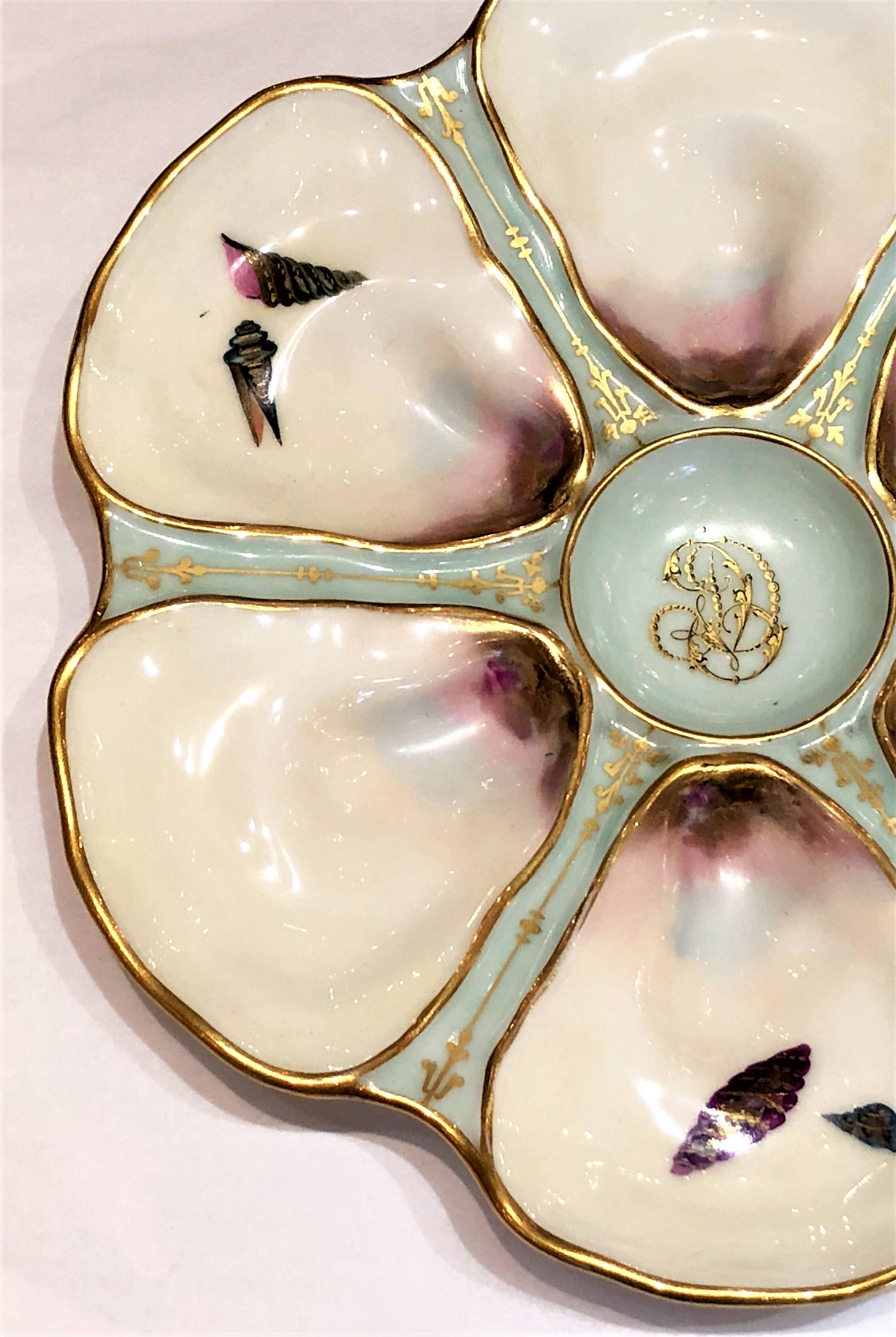 Antique French Limoges hand-painted porcelain oyster plate, circa 1900.