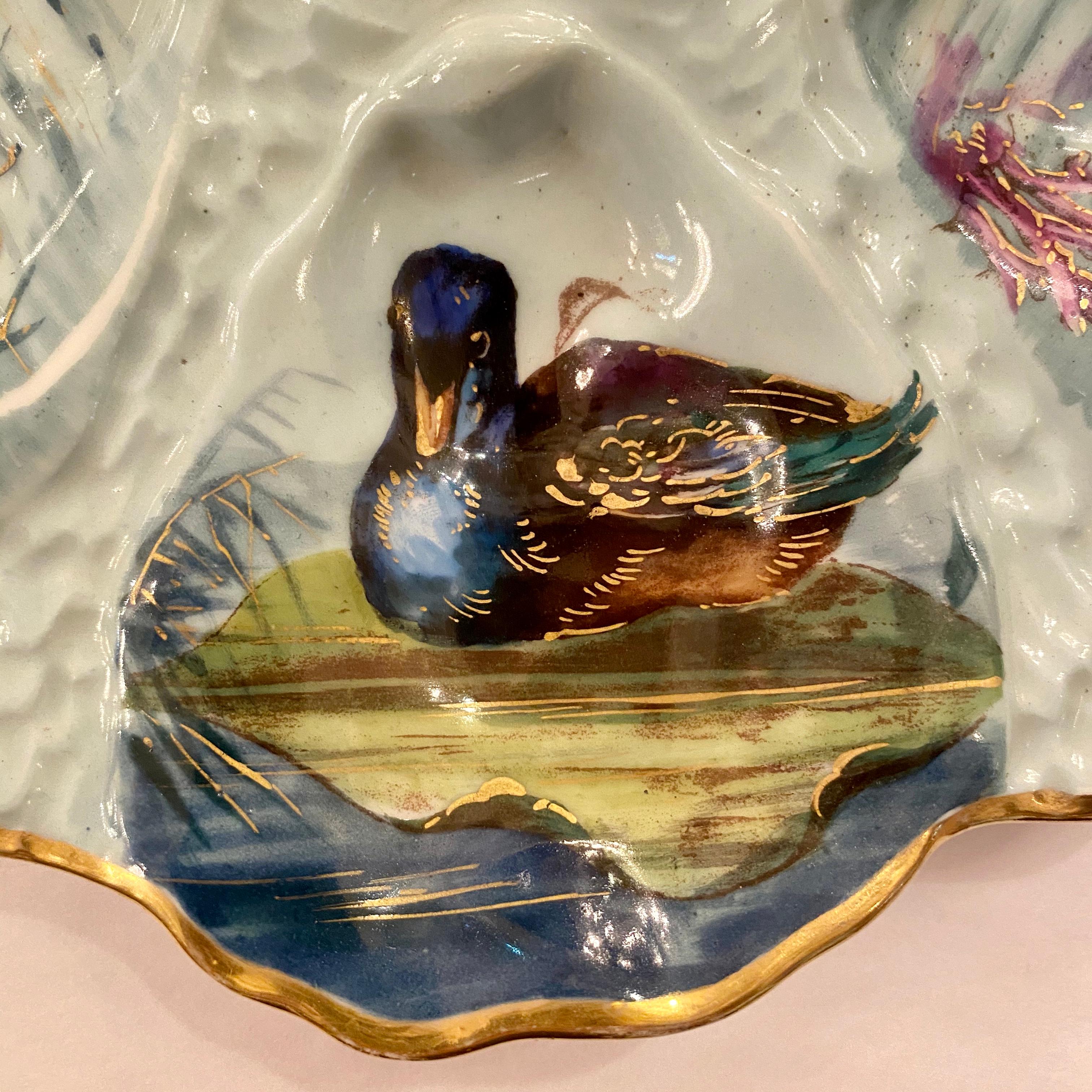 Antique French Limoges porcelain oyster plate with hand painted sea life, circa 1870-1880.
We currently have a coordinating pair of these, each listed and sold individually.