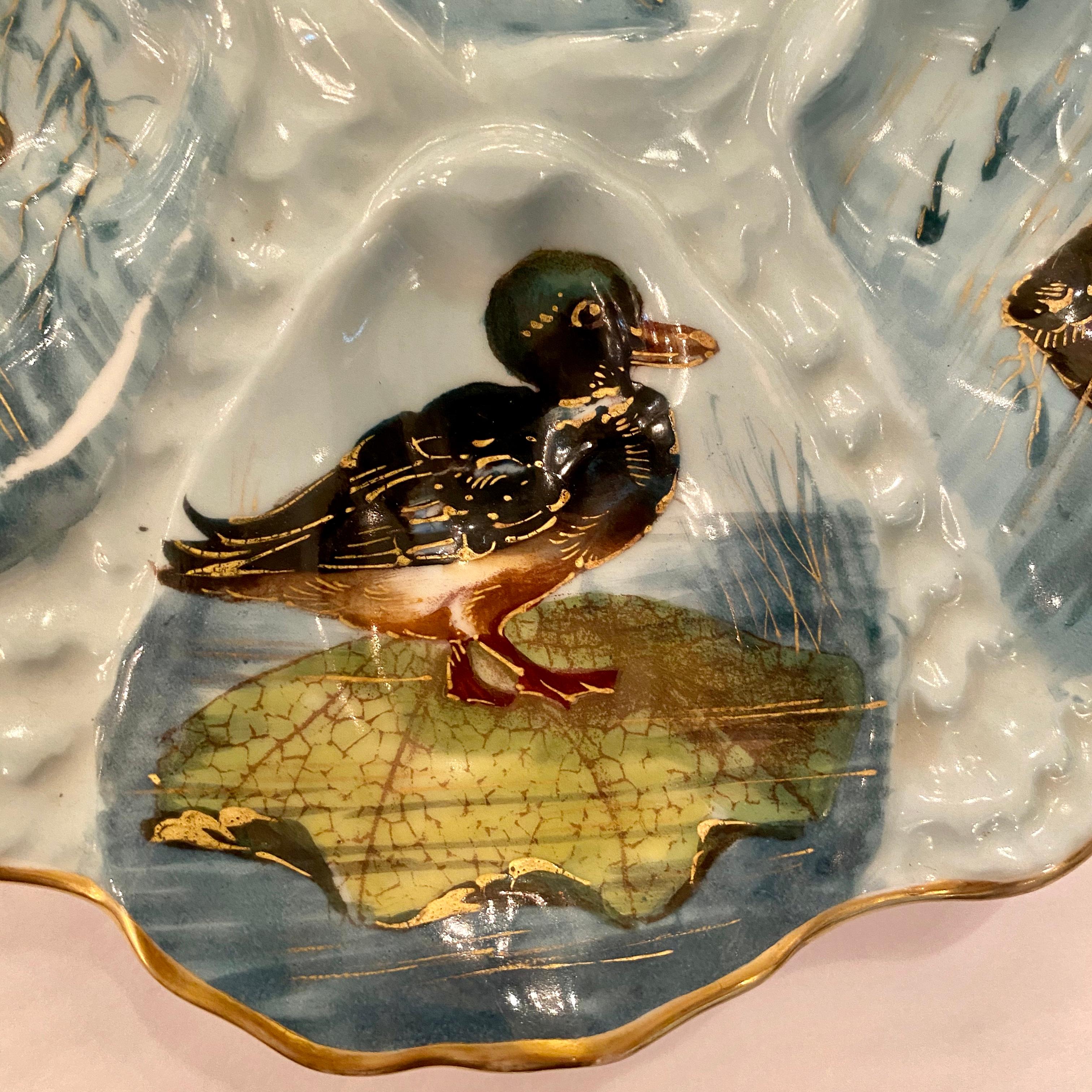 Antique French Limoges porcelain oyster plate with hand painted sea life, circa 1870-1880.
We currently have a coordinating pair of these, each listed and sold individually.