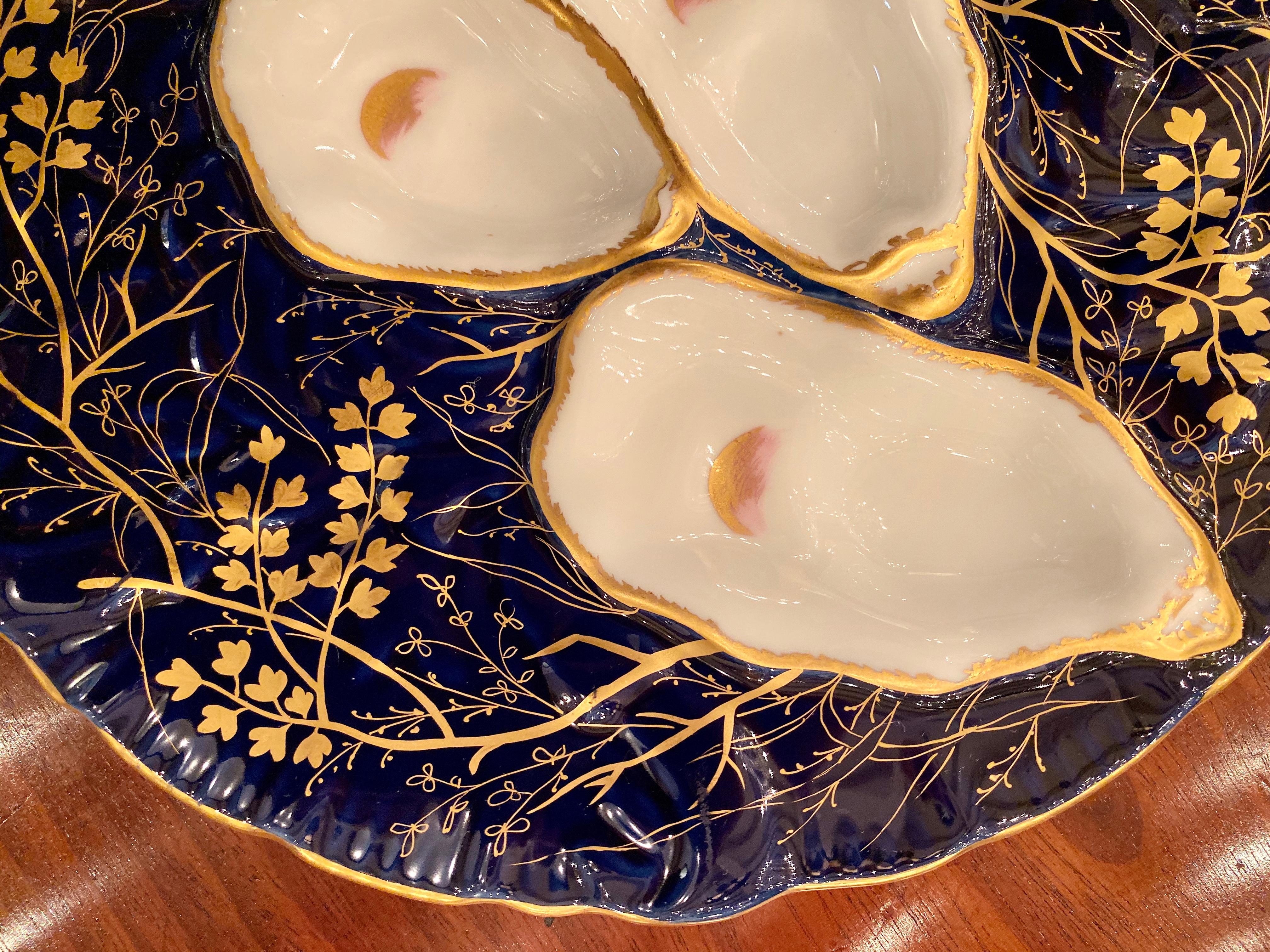 Antique French Limoges Porcelain Turkey pattern oyster plate, circa 1880s. Beautiful cobalt color with gold accents.