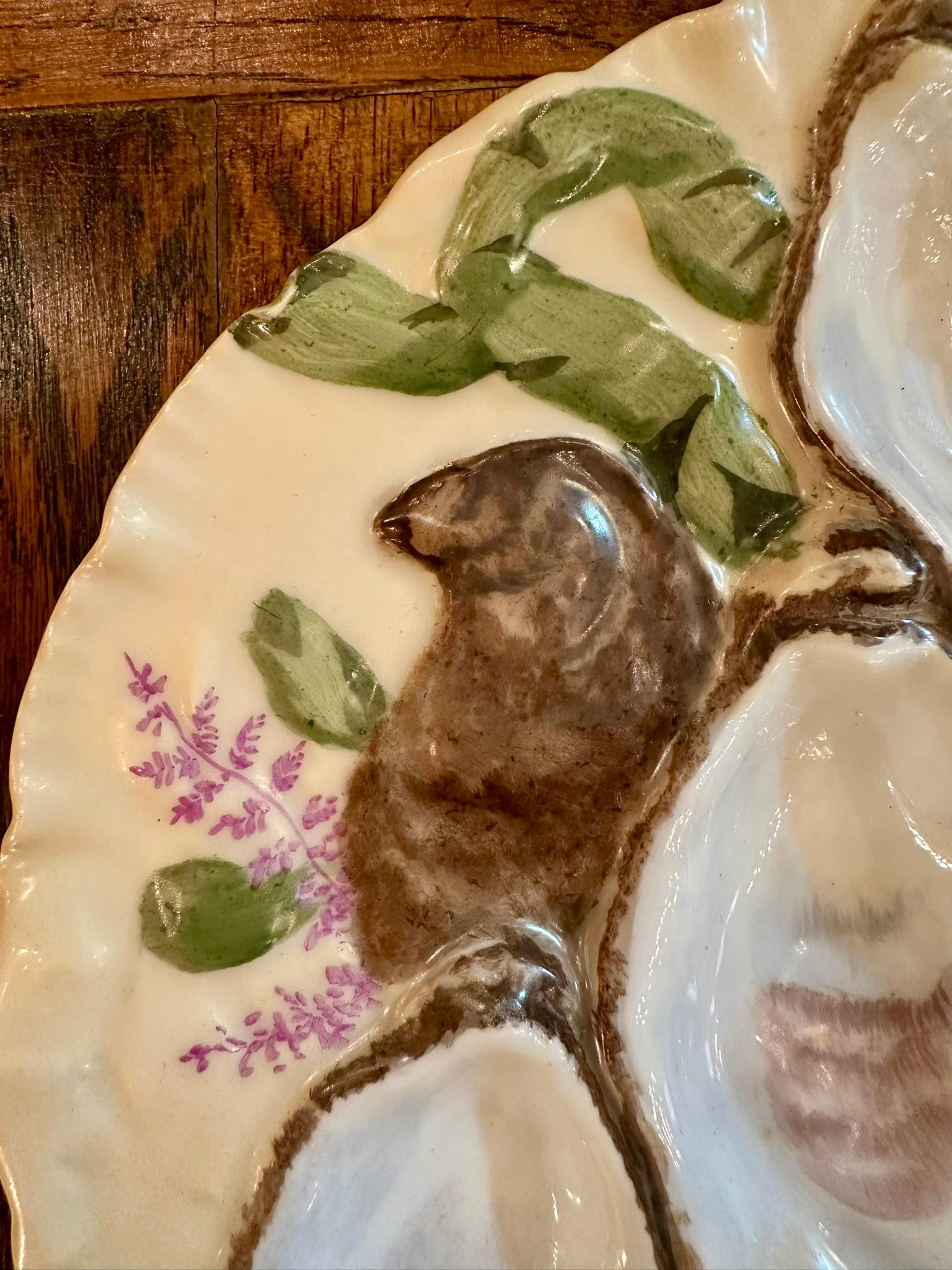 Antique French Limoges Porcelain Turkey Pattern Oyster Plate, Circa 1880's.
Hand-painted in colors of buttercream yellow, sage green and raspberry red.
