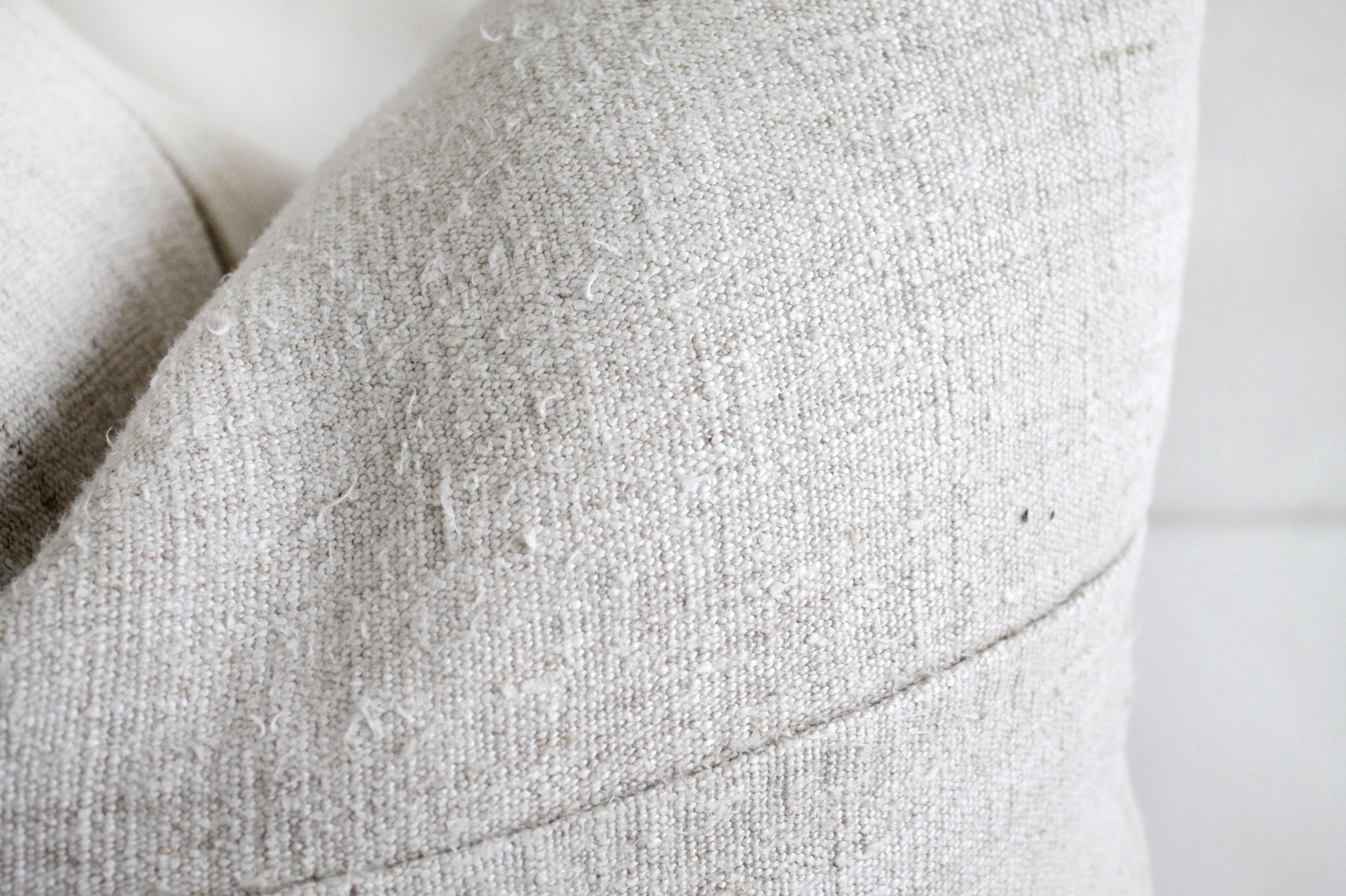 Antique French linen textile pillow with seam
Off white antique French linen textured grain sack pillow with original seam, backside is in a natural soft Irish linen.
Hidden zipper closure. 
Measures: 17