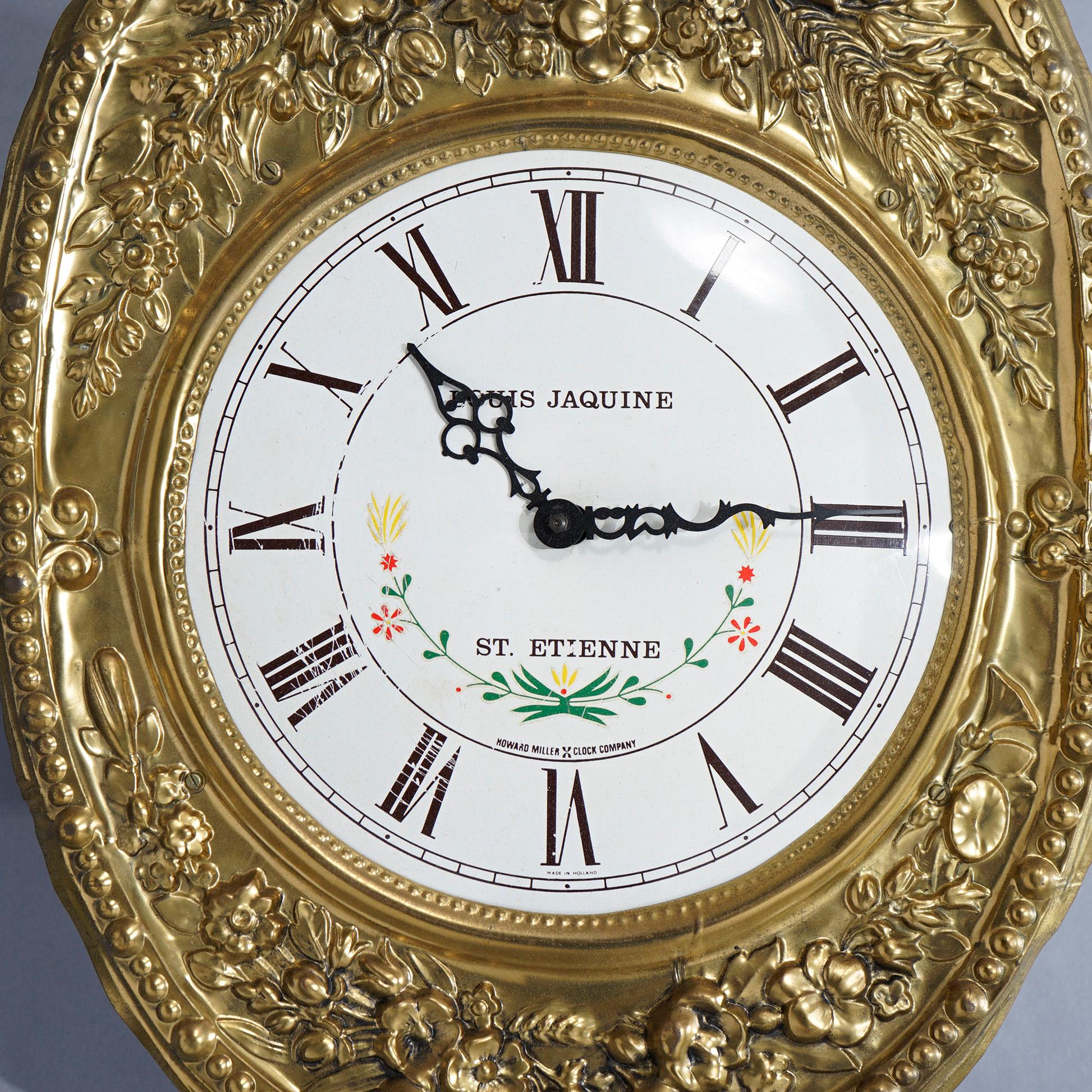 An antique French wag-on-the-wall clock offers brass construction with floral and foliate embossed frame, face with Roman numerals and floral decoration, signed on face as photographed, 19th century

Measures- 58.25'' H x 14.25'' W x 5.75'' D.