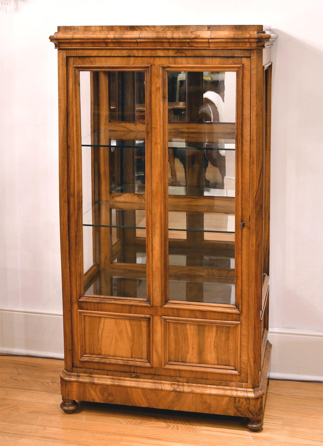 red bookcase with glass doors