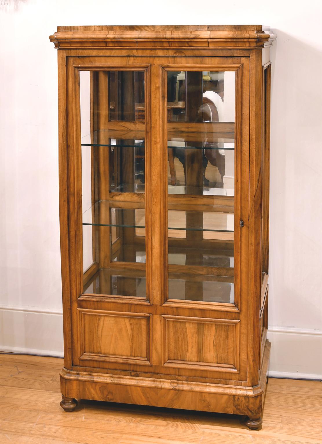 small bookcase with glass doors