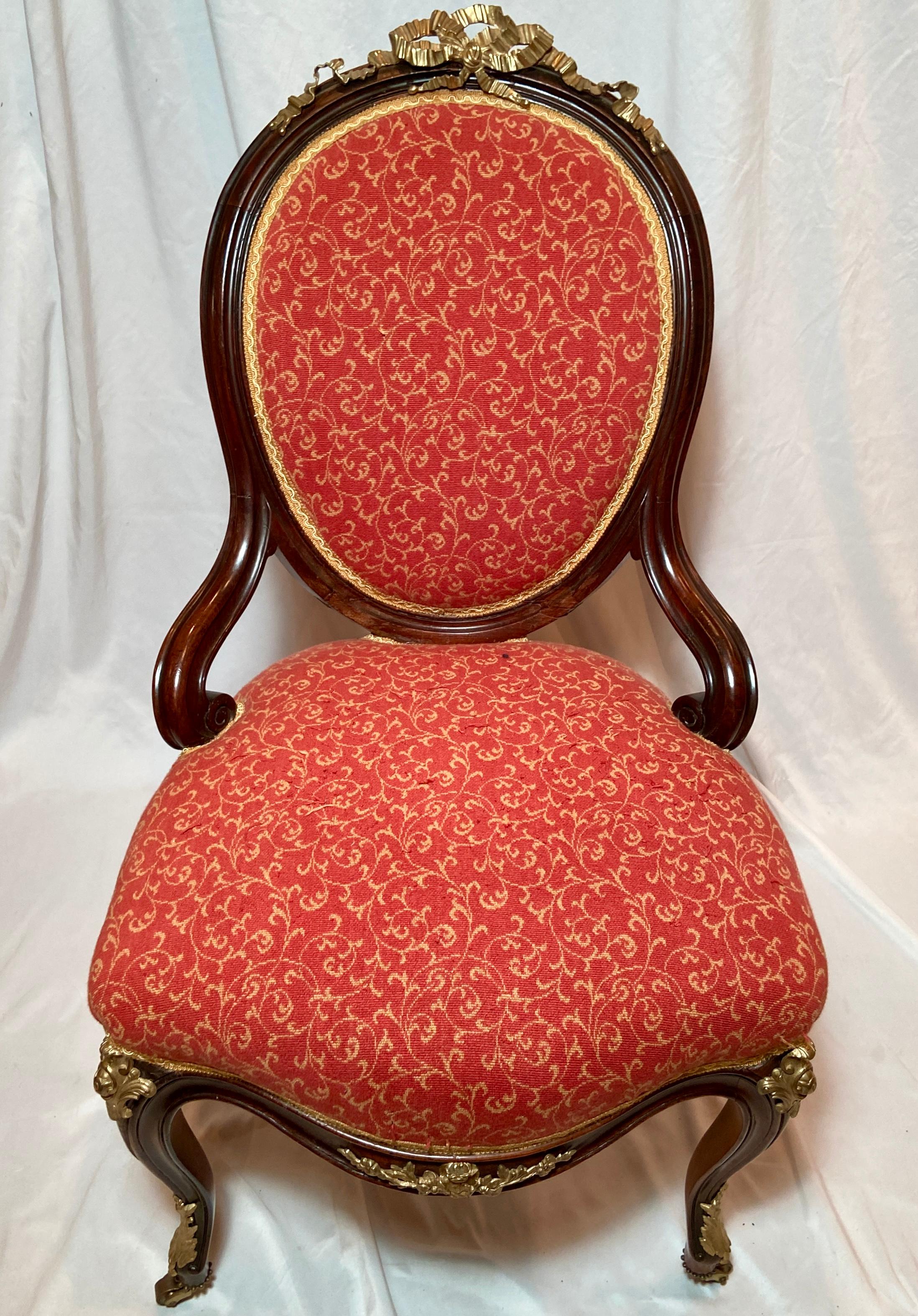 Antique French Louis Philippe gold bronze and rosewood parlor chair with red and gold upholstery, Circa 1880.