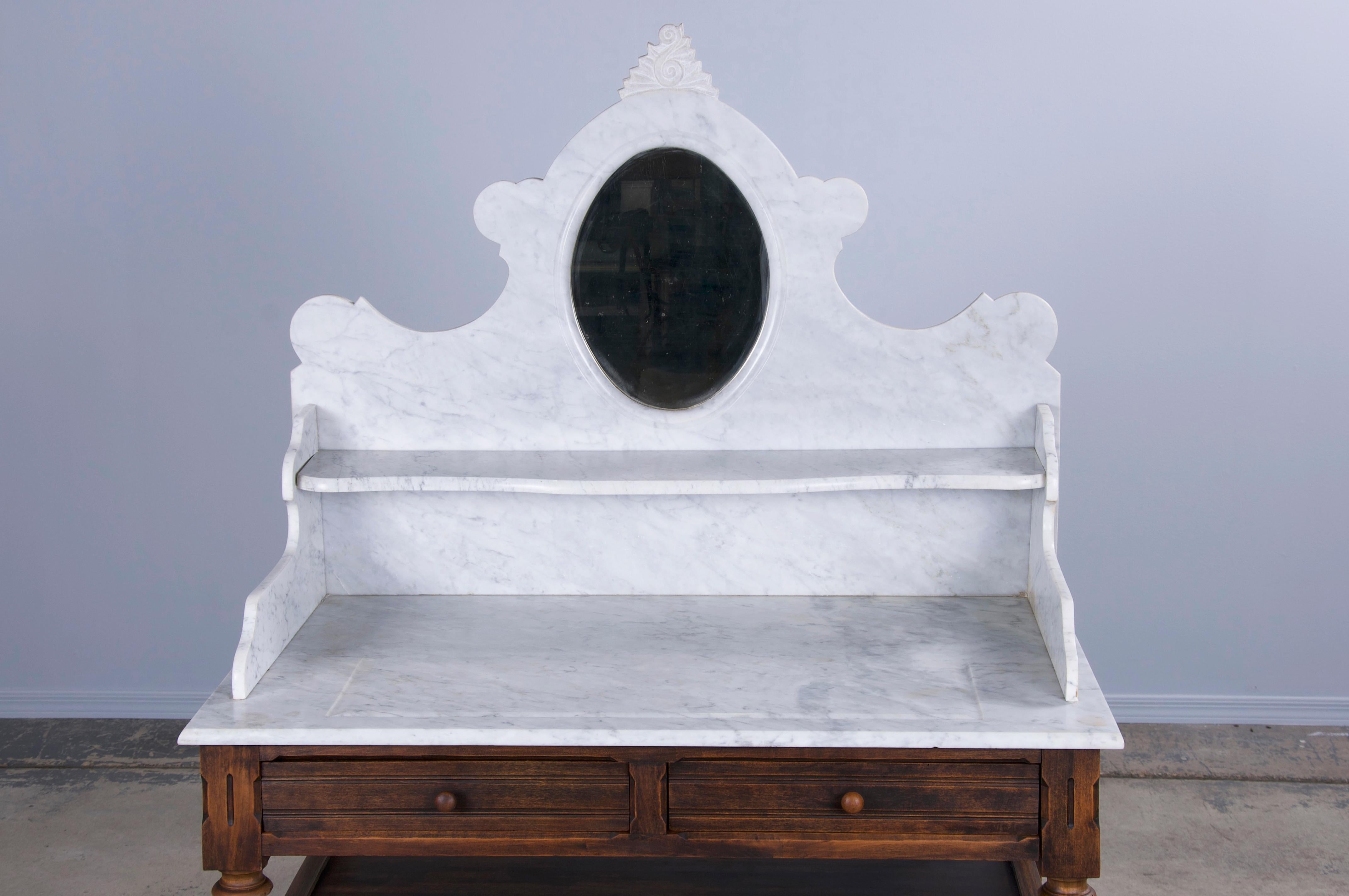 Late 19th-century country French provincial wash table or vanity made in Louis Philippe style, sourced from Provence, France. Beautifully hand-crafted from solid maple showcasing a naturally aged warm patina. The top of the wash table is crowned