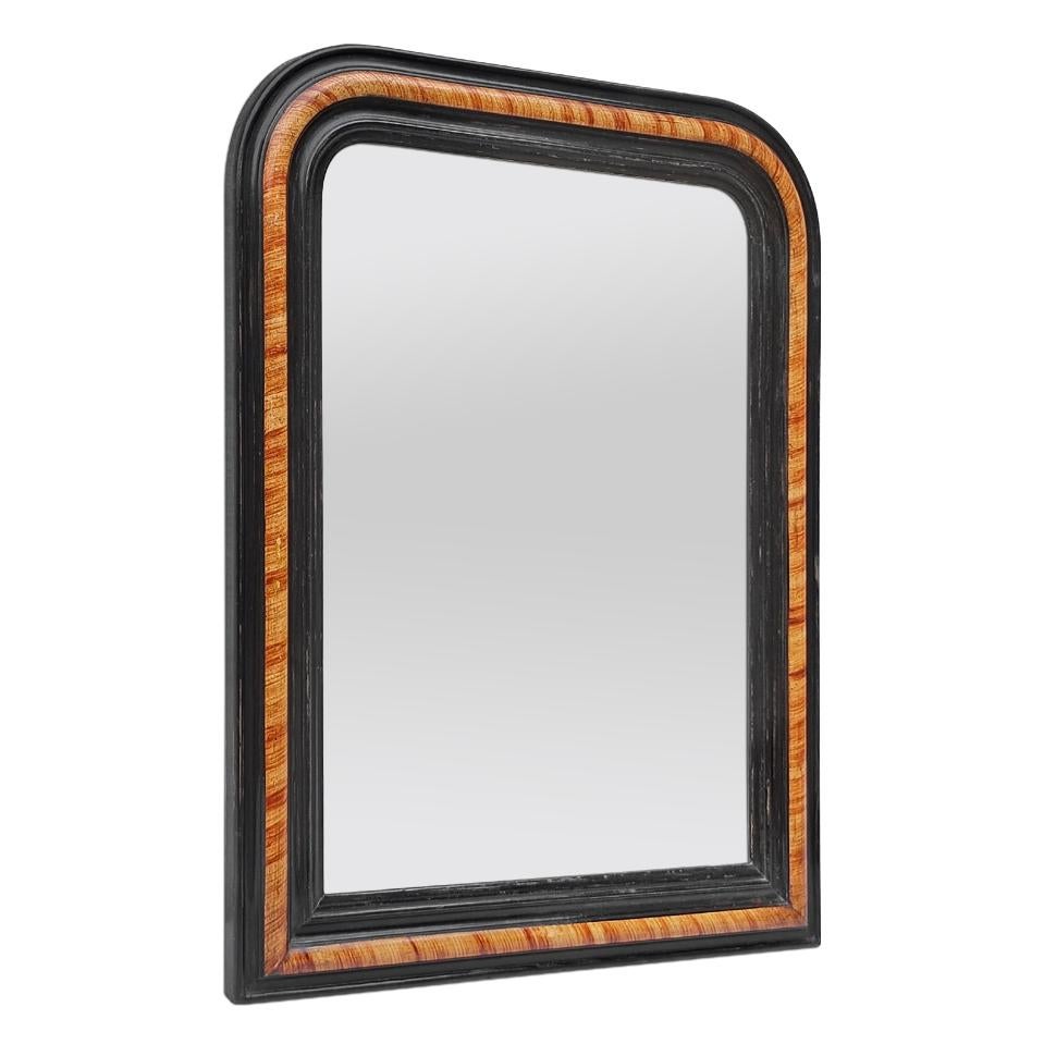 Antique French mirror in the Louis-Philippe style with black painted frame and imitation rosewood decoration. Antique frame width: 7 cm / 2.75 in. Modern glass mirror. Wood back.