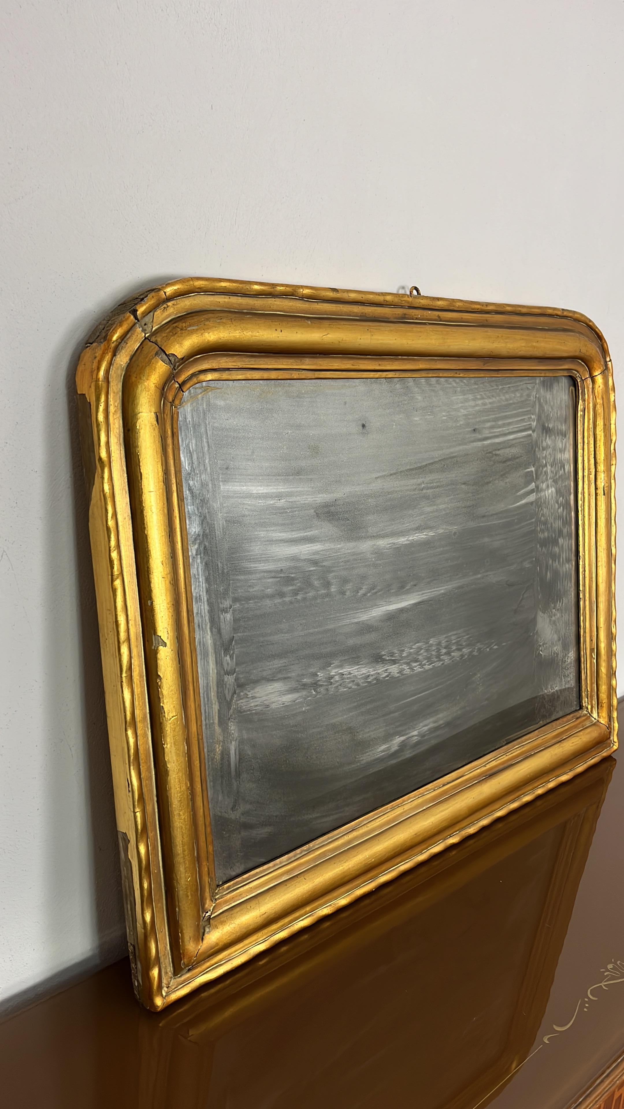 Antique French Louis Philippe wall mirror in wood and gold leaf, 1930s
To be restored, found in a noble apartment in my city, Palermo.
Observe the details, such as the plates on the back. Everything confirms that it is an ancient object, rare
