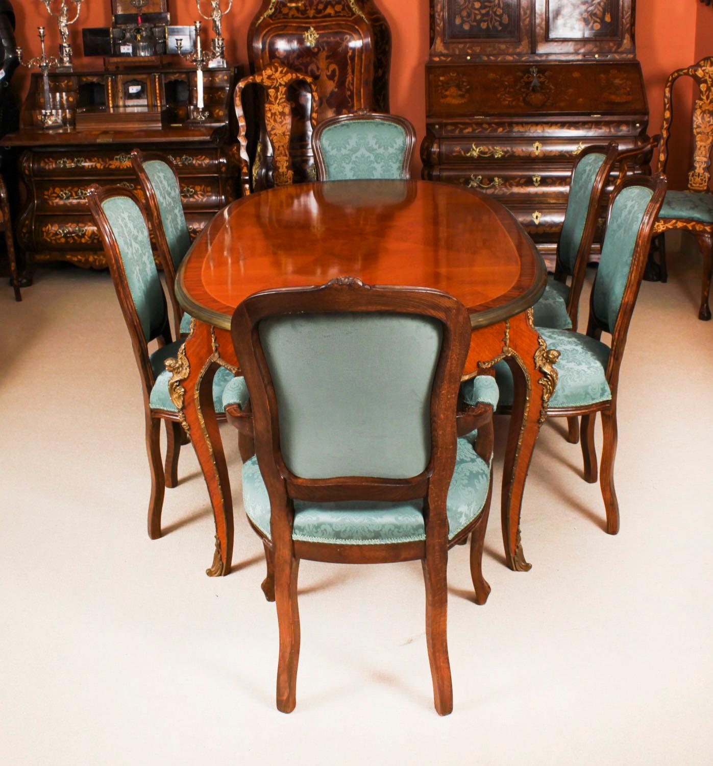 This is a beautiful dining set comprising an antique French Louis Revival dining table, Circa 1920 in date, and a beautiful set of six Gondola Dining Chairs C1950.
 
This antique French Louis Revival dining table, adorned with ormolu mounts,