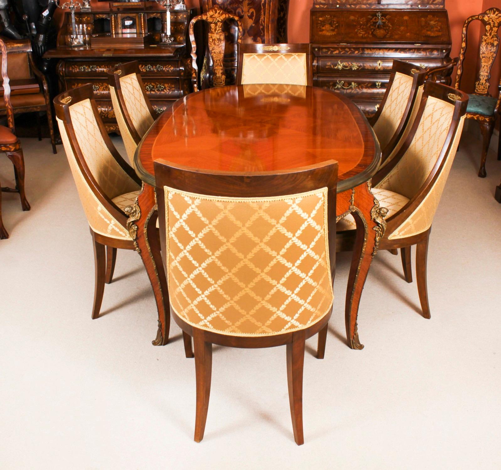This is a beautiful dining set comprising an antique French Louis Revival dining table, Circa 1920 in date, and a beautiful set of six Gondola Dining Chairs C1950.
 
This antique French Louis Revival dining table, adorned with ormolu mounts,