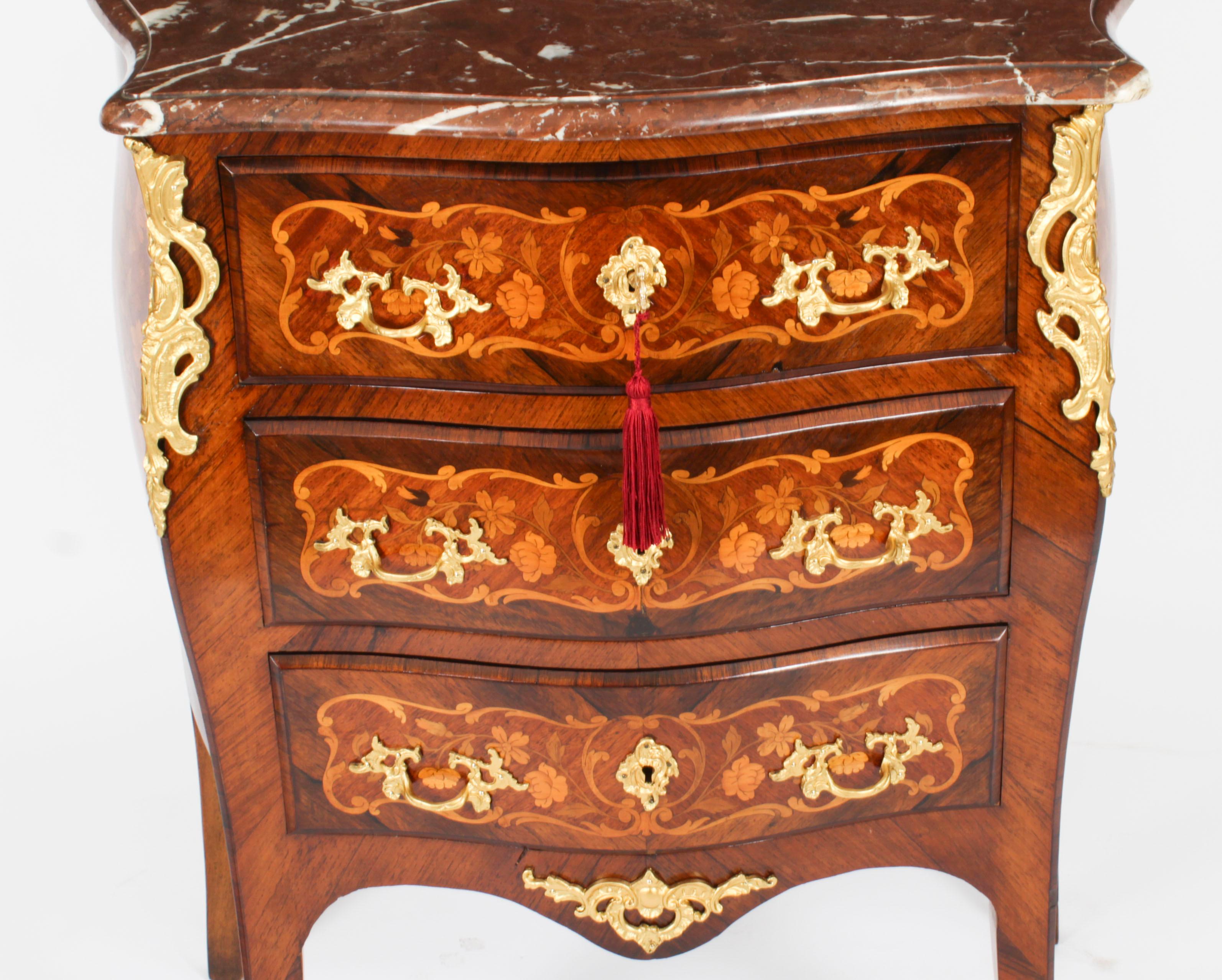 This is a stunning antique French Gonçalo Alves Louis Revival  commode, circa 1880 in date. 

This gorgeous commode features a serpentine Rouge Griotte marble top above three full width drawers for ample storage, and was inspired by the Louis XV