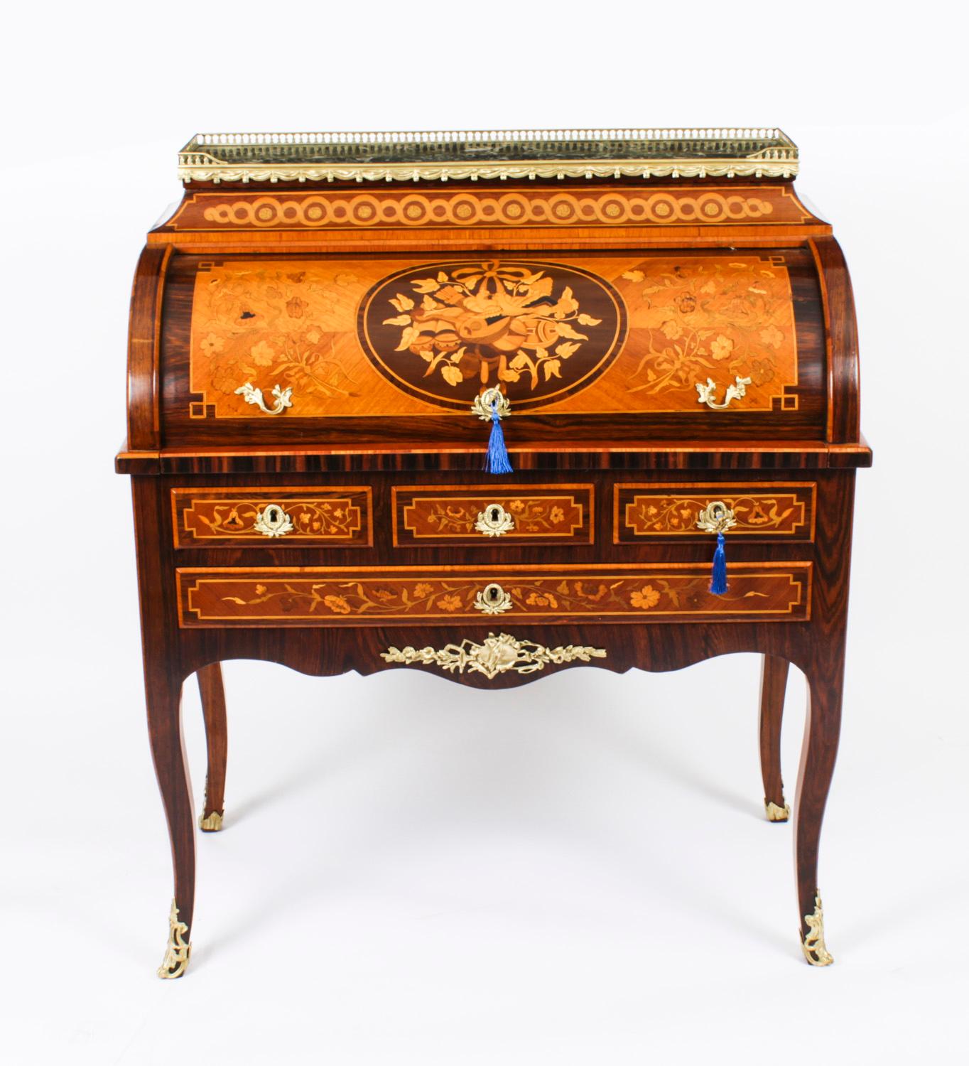 This is a gorgeous antique French goncalo alves & walnut marquetry Louis Revival secretaire a cylindre, circa 1830 in date.

It is decorated throughout with beautiful floral marquetry with trophies, lovebirds, ribbons and flowering stems, the