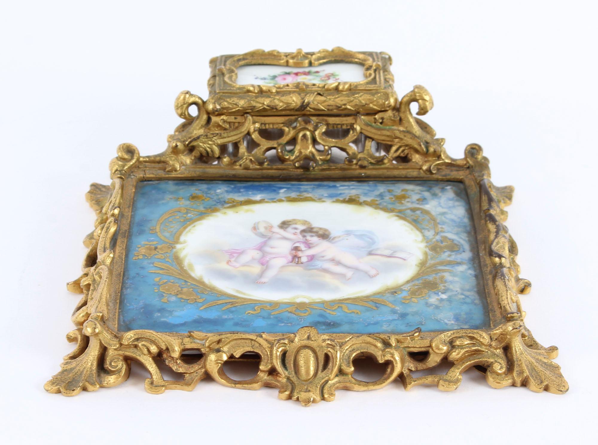This is a wonderful antique French Louis Revival ormolu and Sevres porcelain inkstand, circa 1870 in date.

This stunning inkstand is mounted with an exquisite Bleu Celeste Sevres porcelain panel of rectangular shape, which has been masterfully