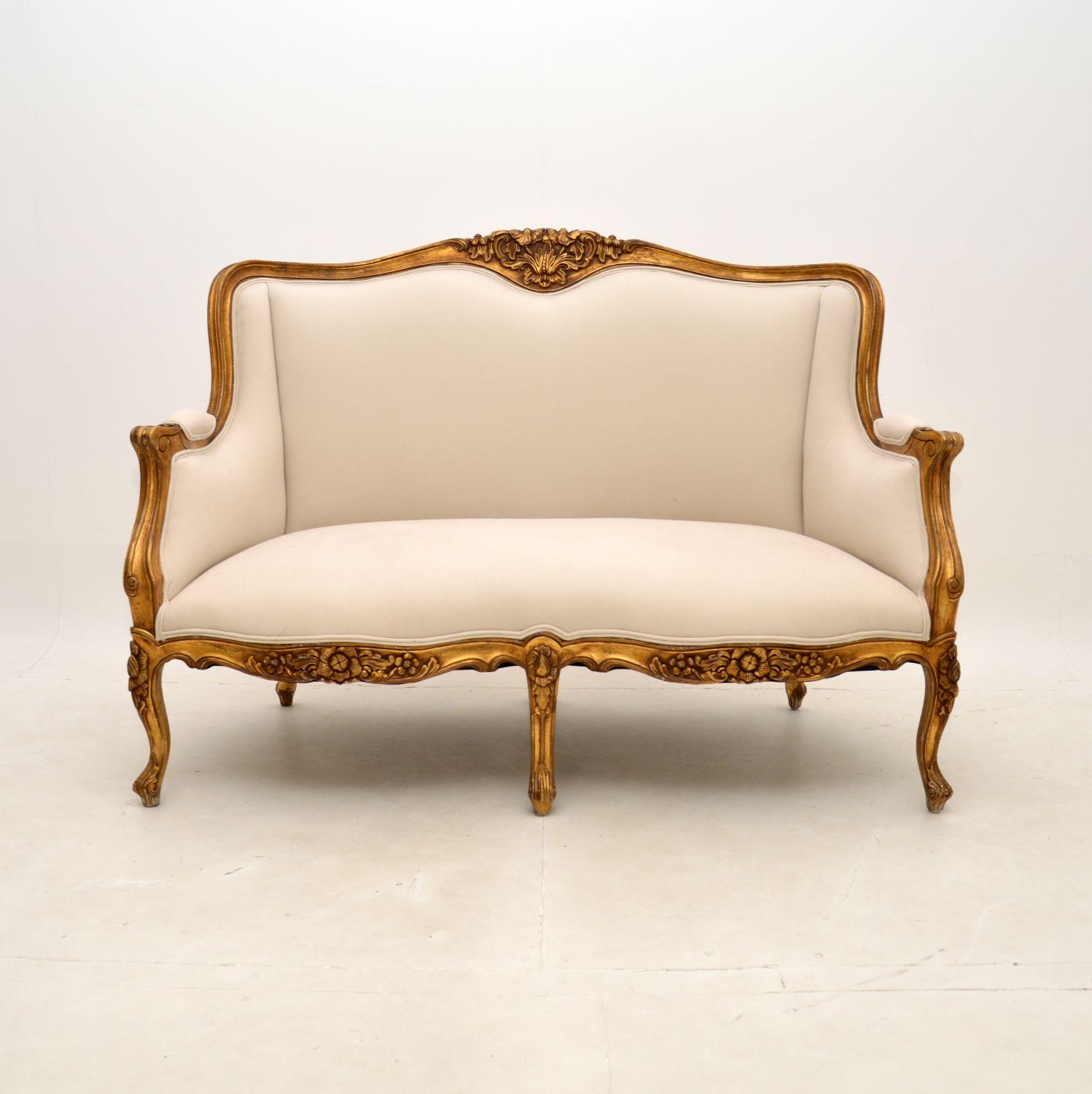 A stunning and top quality antique French Louis style gilt wood sofa, dating from around the 1930’s period.

It is beautifully made, with a gorgeous shape and beautiful carving. The gilt wood frame has some minor wear and distressing to the gilding,