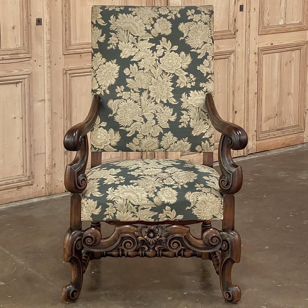 Antique French Louis XIV armchair, Fauteuil exudes a majestic presence making it perfect as a focal point in any seating area, or as a stand-alone work or reading station. The frame was handcrafted on a relatively large scale from solid sycamore,