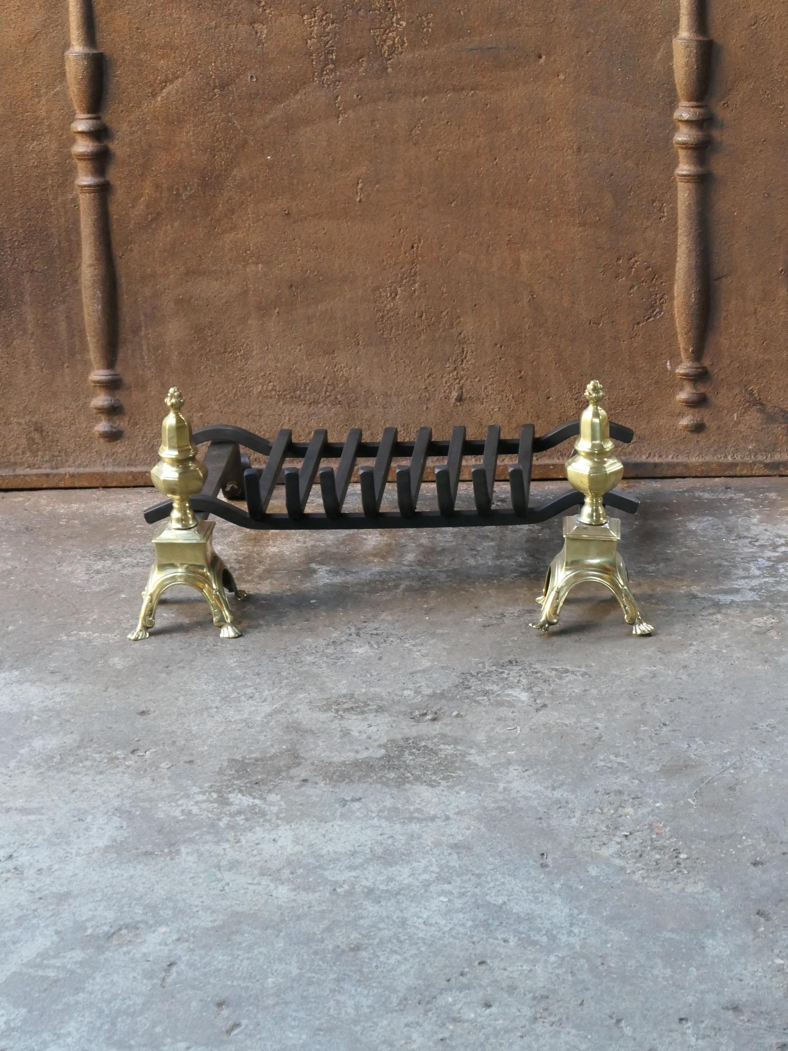 French 17th - 18th century fireplace basket or fire grate from the Louis XIV period. The fireplace grate is made of wrought iron and polished brass. The condition is good.



















 