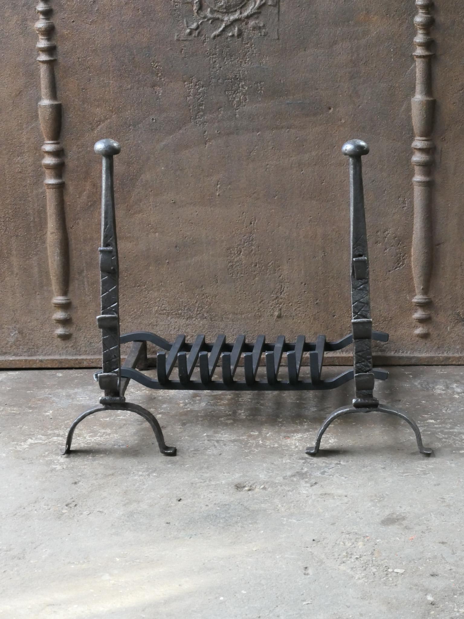 French 17th - 18th century fireplace basket or fire grate consisting of period andirons (Louis XIV) and a recently forged grate. The fireplace grate is made of wrought iron. The condition is good.



















 