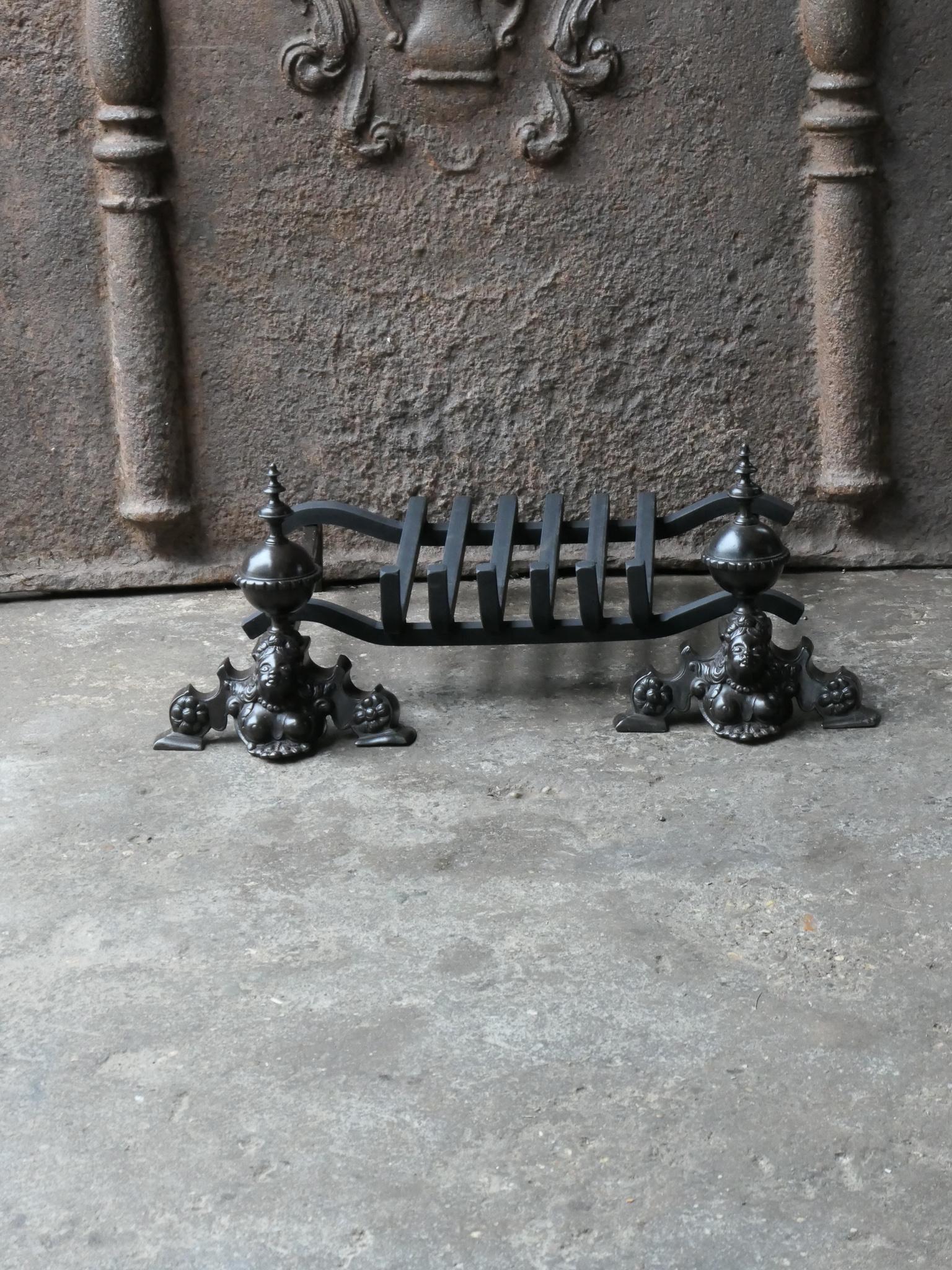 French 17th century fireplace basket or fire grate from the Louis XIV period. The fireplace grate is made of wrought iron and brass. The condition is good.



















 