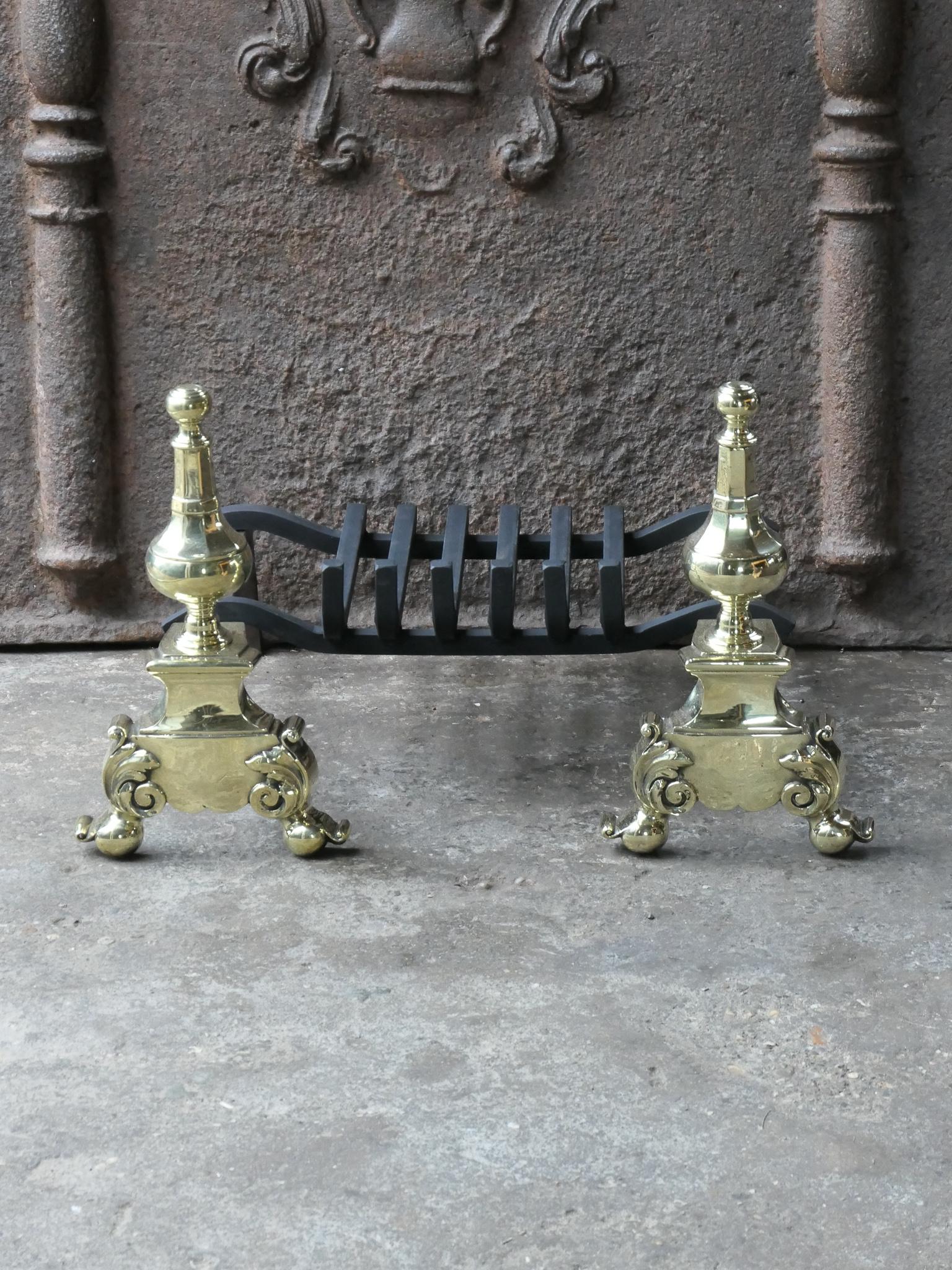 French 18th century fireplace basket or fire grate from the Louis XV period. The fireplace grate is made of wrought iron and polished brass. The condition is good.



















